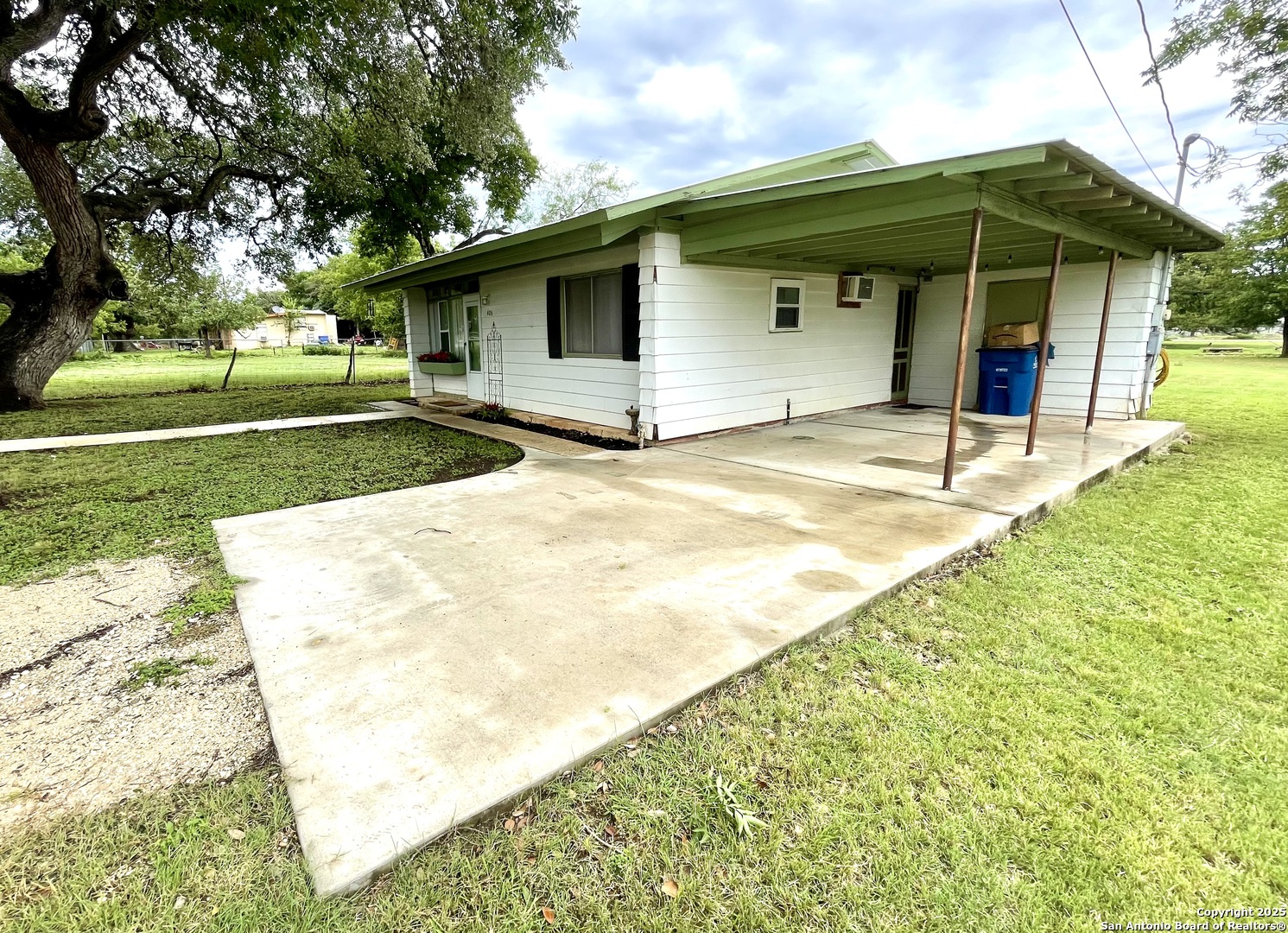 406 Hackberry Street Bandera, TX 78003 - Photo 31 of 34 a view of a backyard of the house