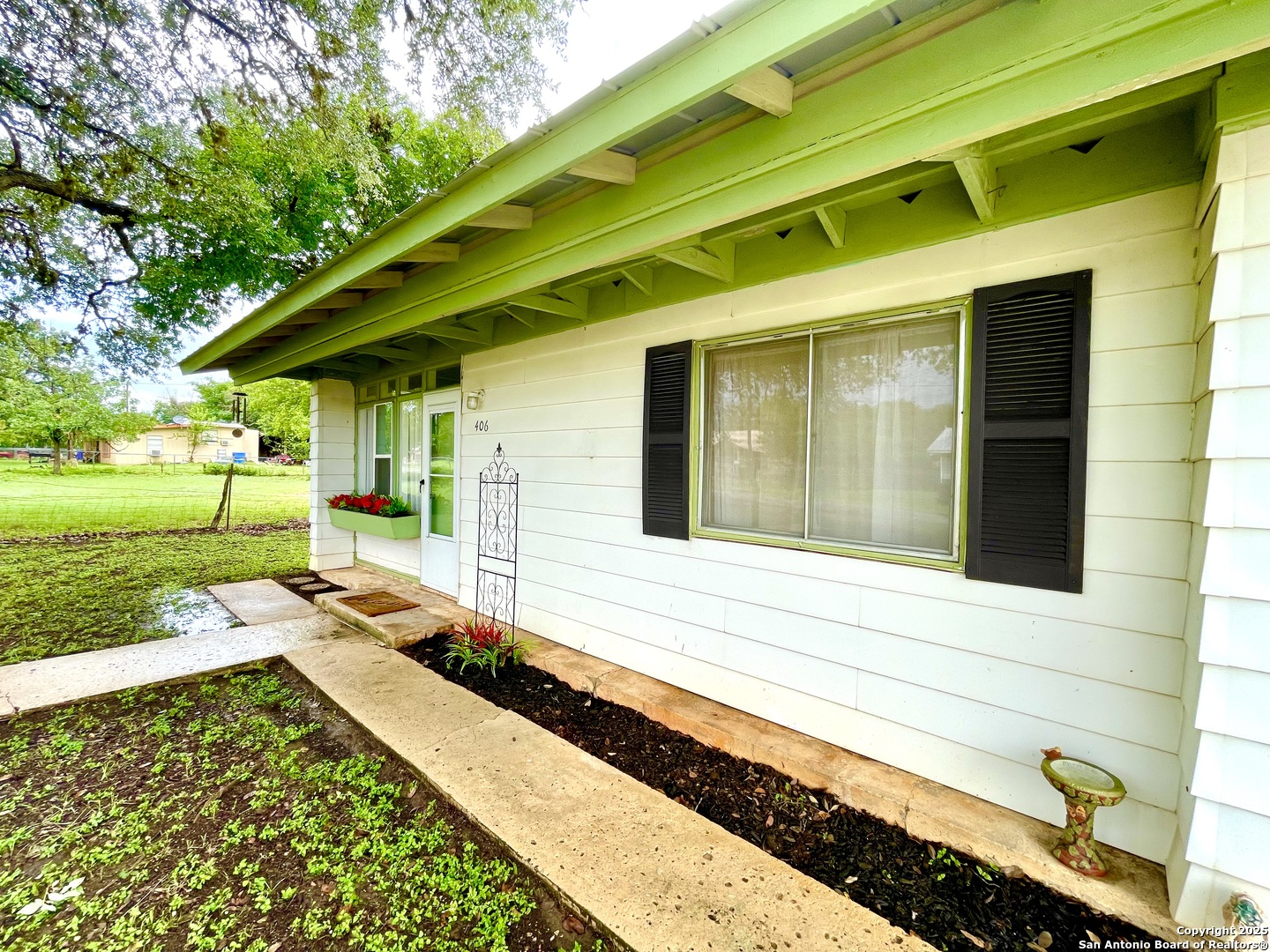 406 Hackberry Street Bandera, TX 78003 - Photo 32 of 34 a front view of a house with a yard