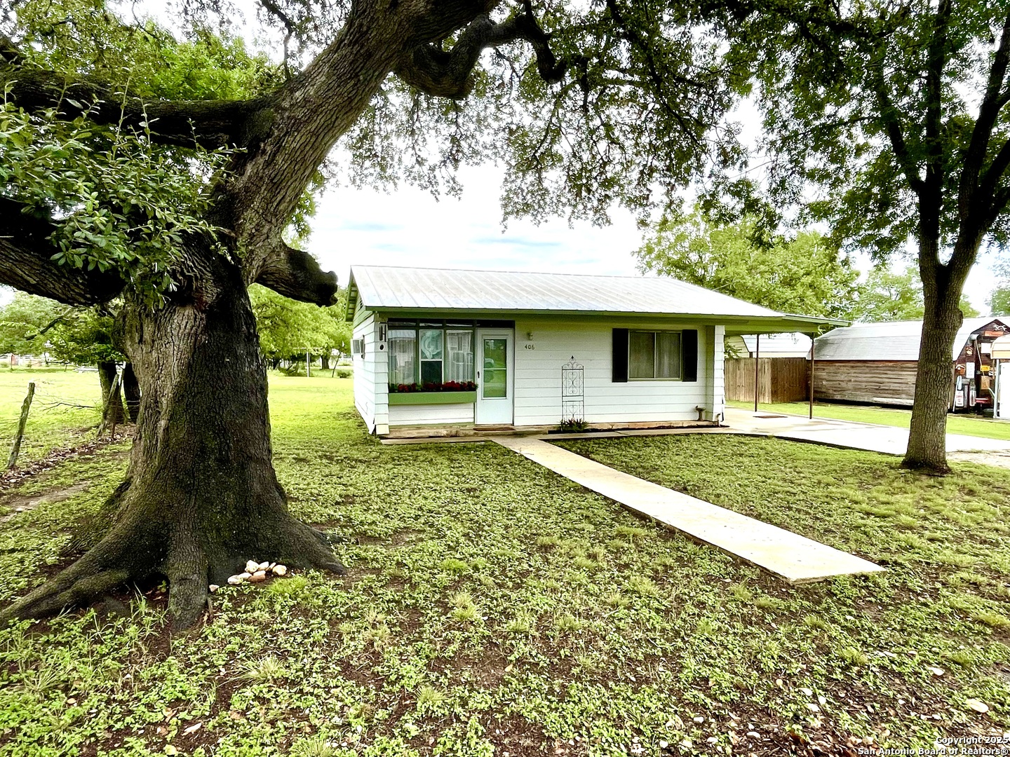 406 Hackberry Street Bandera, TX 78003 - Photo 33 of 34 a front view of a house with a yard