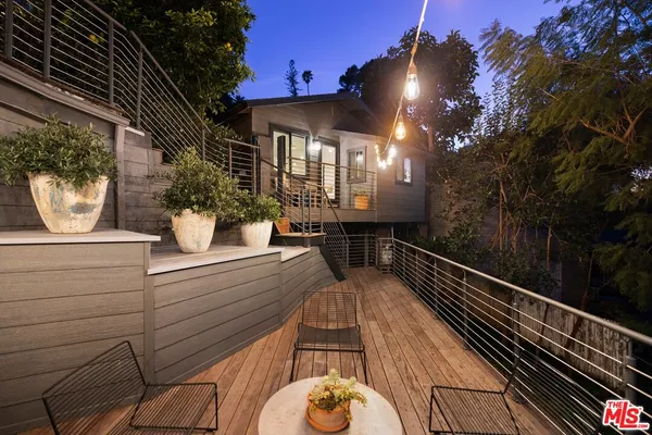 a view of a balcony with chairs
