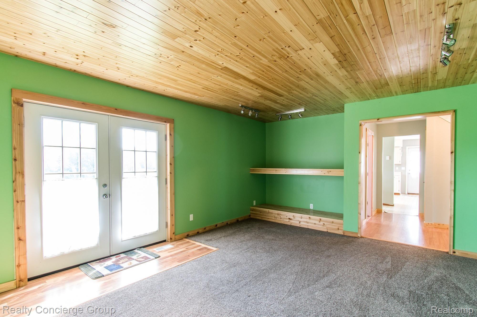 5150 North Fowlerville Road Fowlerville, MI 48836 - Photo 11 of 44 Wood ceiling and track lighting