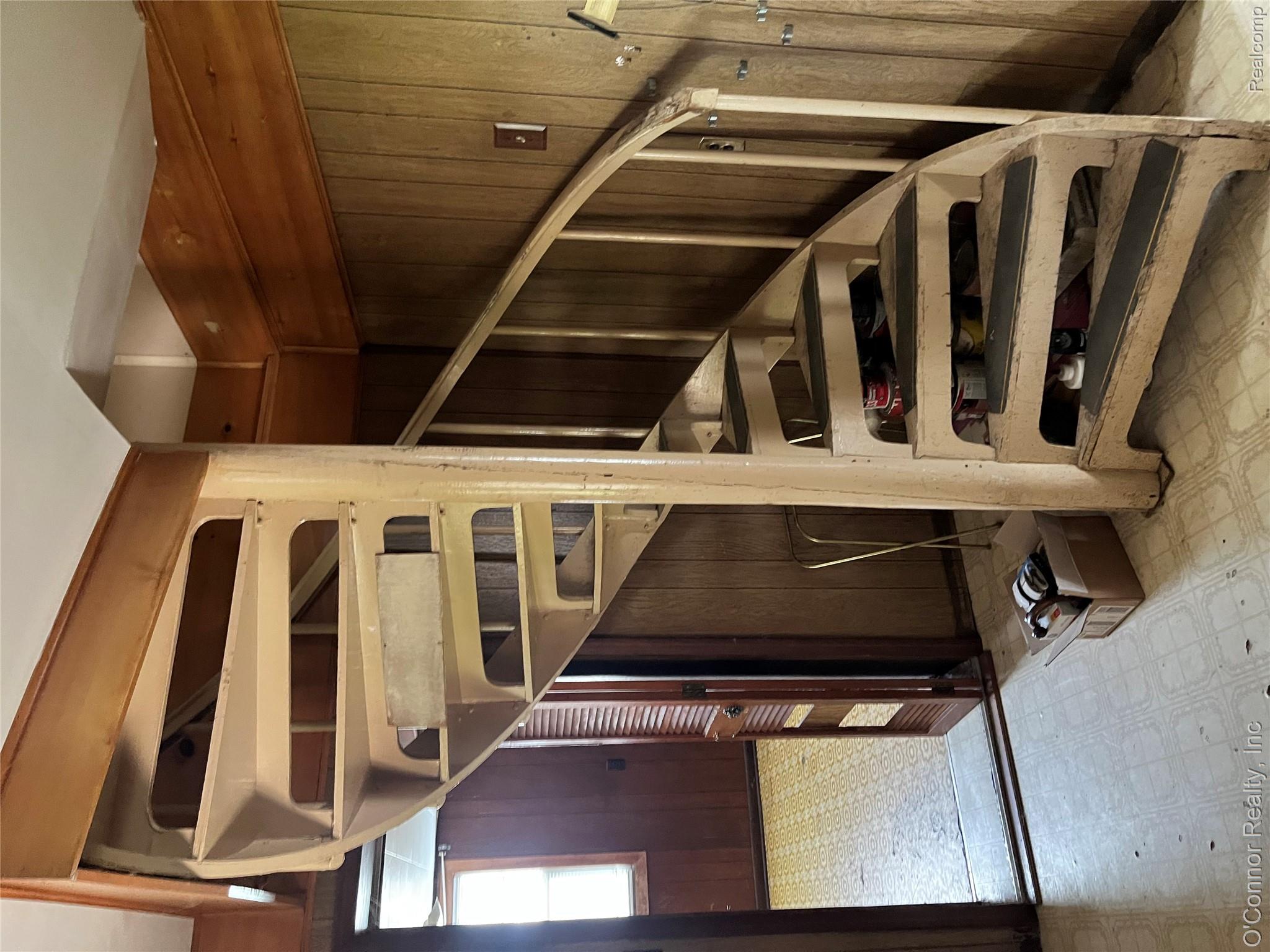 3909 Burtch Road Fort Gratiot, MI 48059 - Photo 19 of 19 Spiral staircase with painted treads