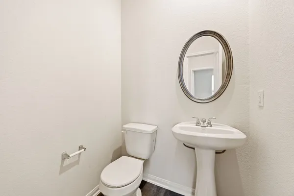 an empty room with windows and ceiling fan