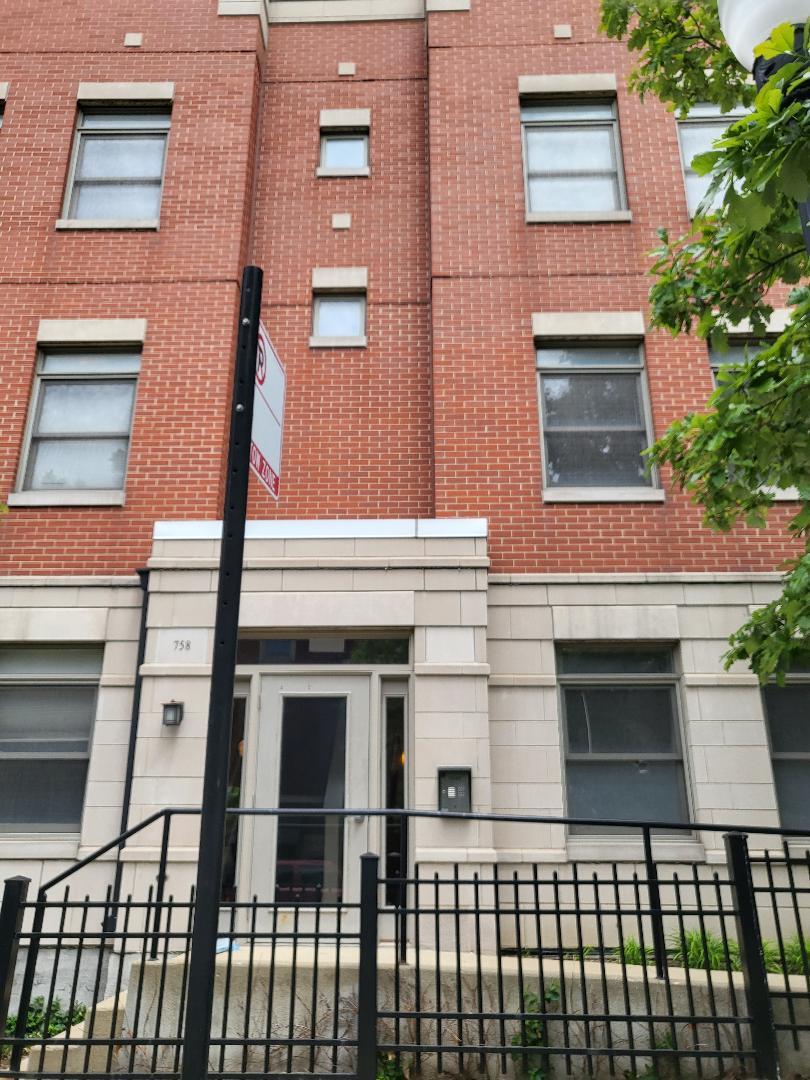 758 West 15th Street, Unit 3B Chicago, IL 60607 - Photo 2 of 30 front view of a brick house with a window