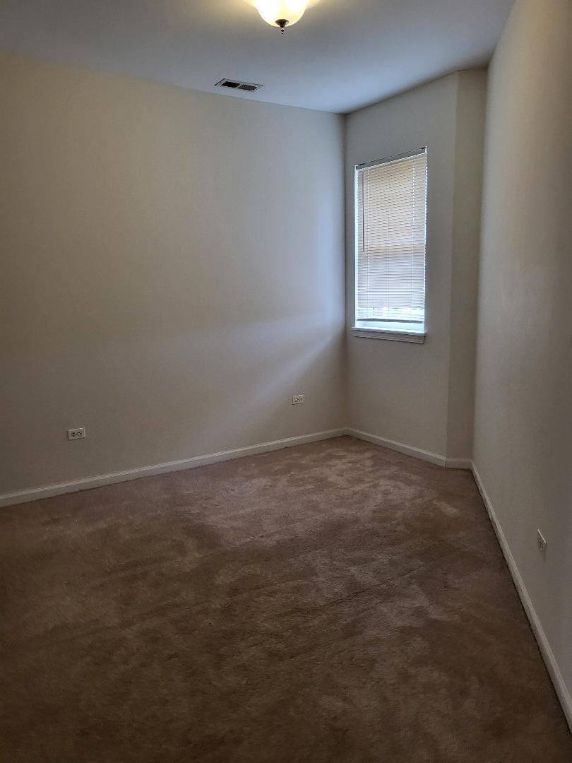 758 West 15th Street, Unit 3B Chicago, IL 60607 - Photo 21 of 30 an empty room with a window
