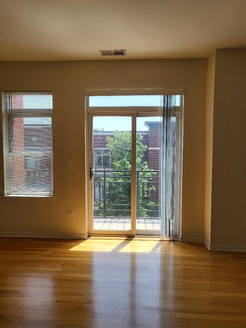 758 West 15th Street, Unit 3B Chicago, IL 60607 - Photo 25 of 30 a view of empty room with wooden floor and fan