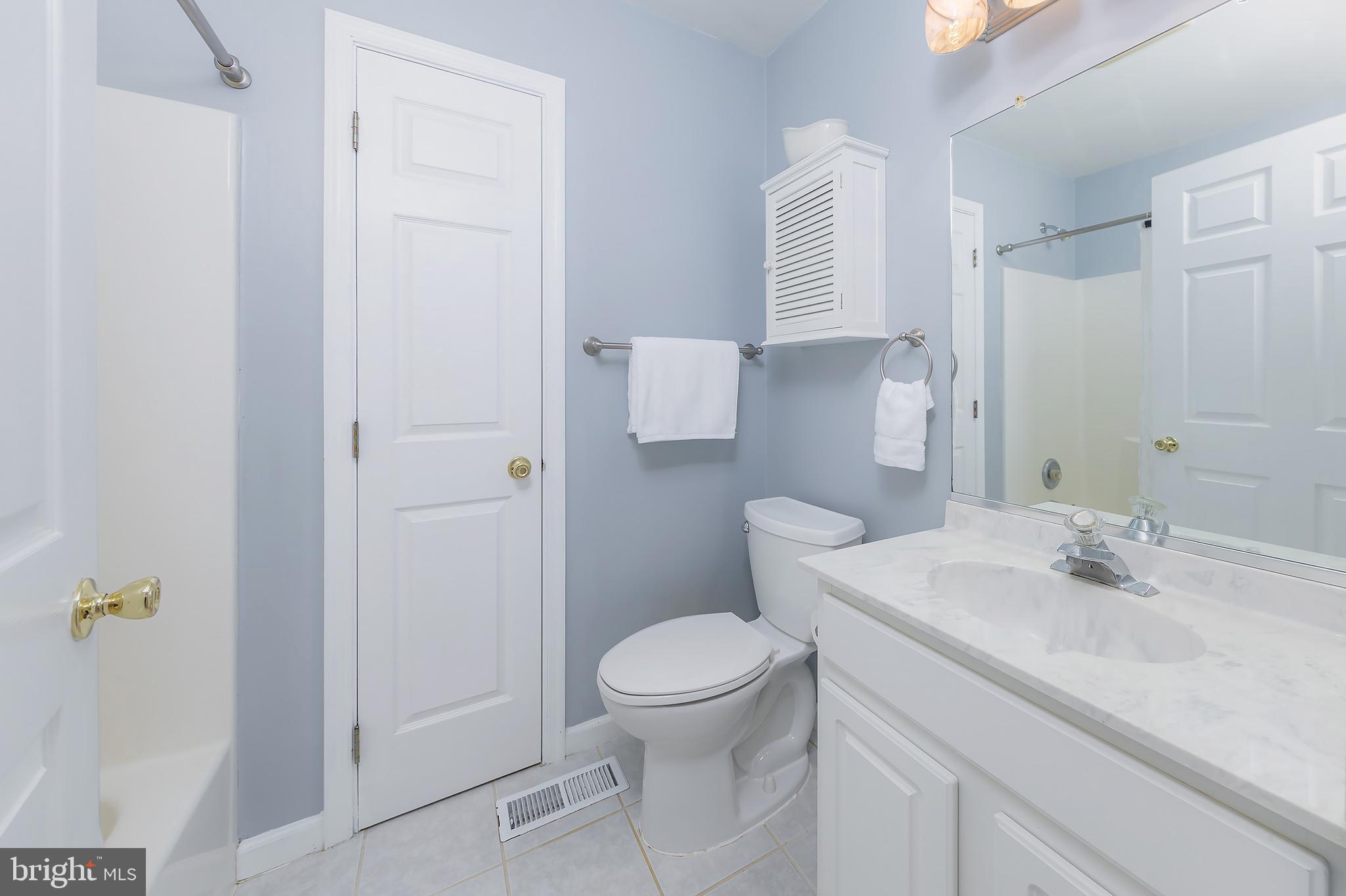 4056 Oak Road Buena, NJ 08310 - Photo 22 of 39 a bathroom with a sink a toilet and shower