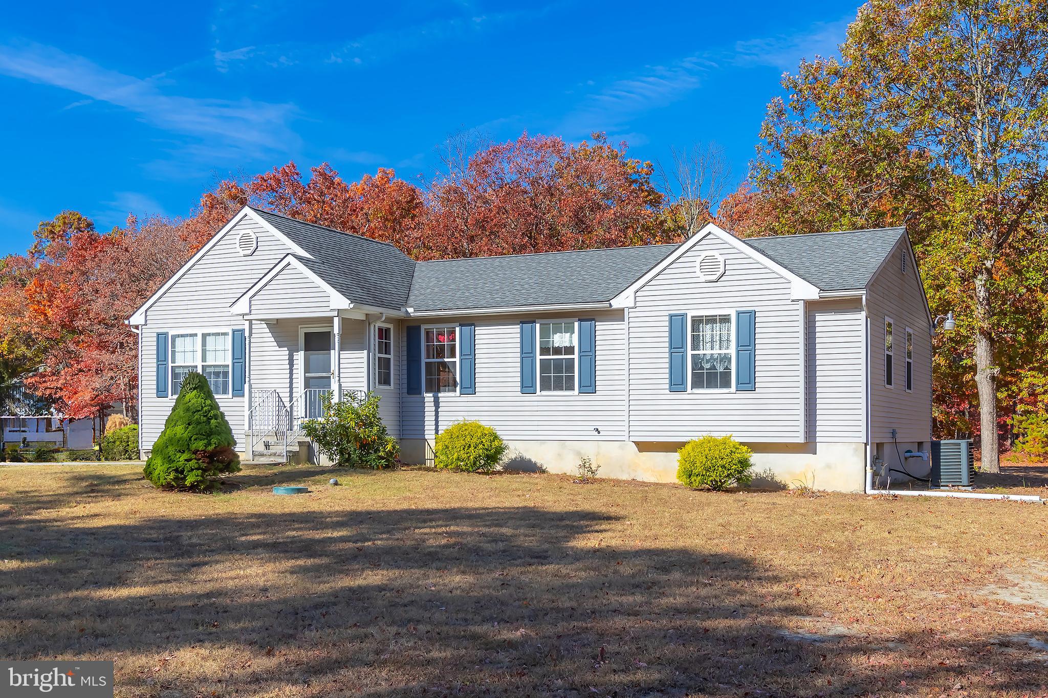 4056 Oak Road Buena, NJ 08310 - Photo 34 of 39 a front view of a house with a yard and potted plants