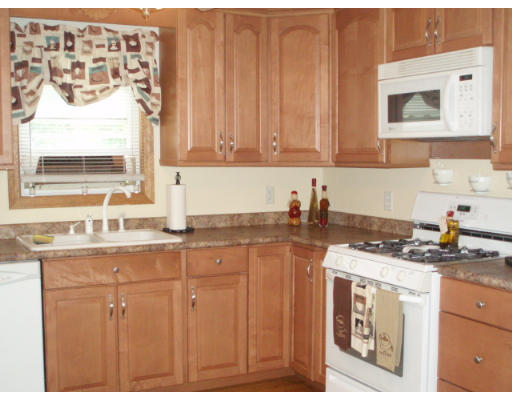 1 Emeline Road Weymouth, MA 02189 - Photo 3 of 12 a kitchen with stainless steel appliances granite countertop a sink stove and cabinets