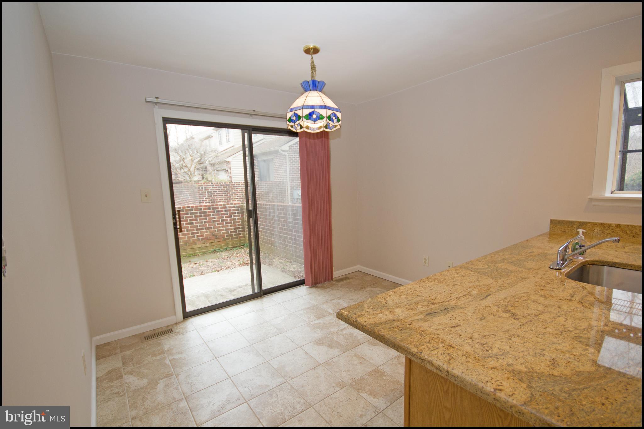 22 Knox Court Chesterbrook, PA 19087 - Photo 8 of 33 Eat-in Kitchen with slider to the front courtyard.