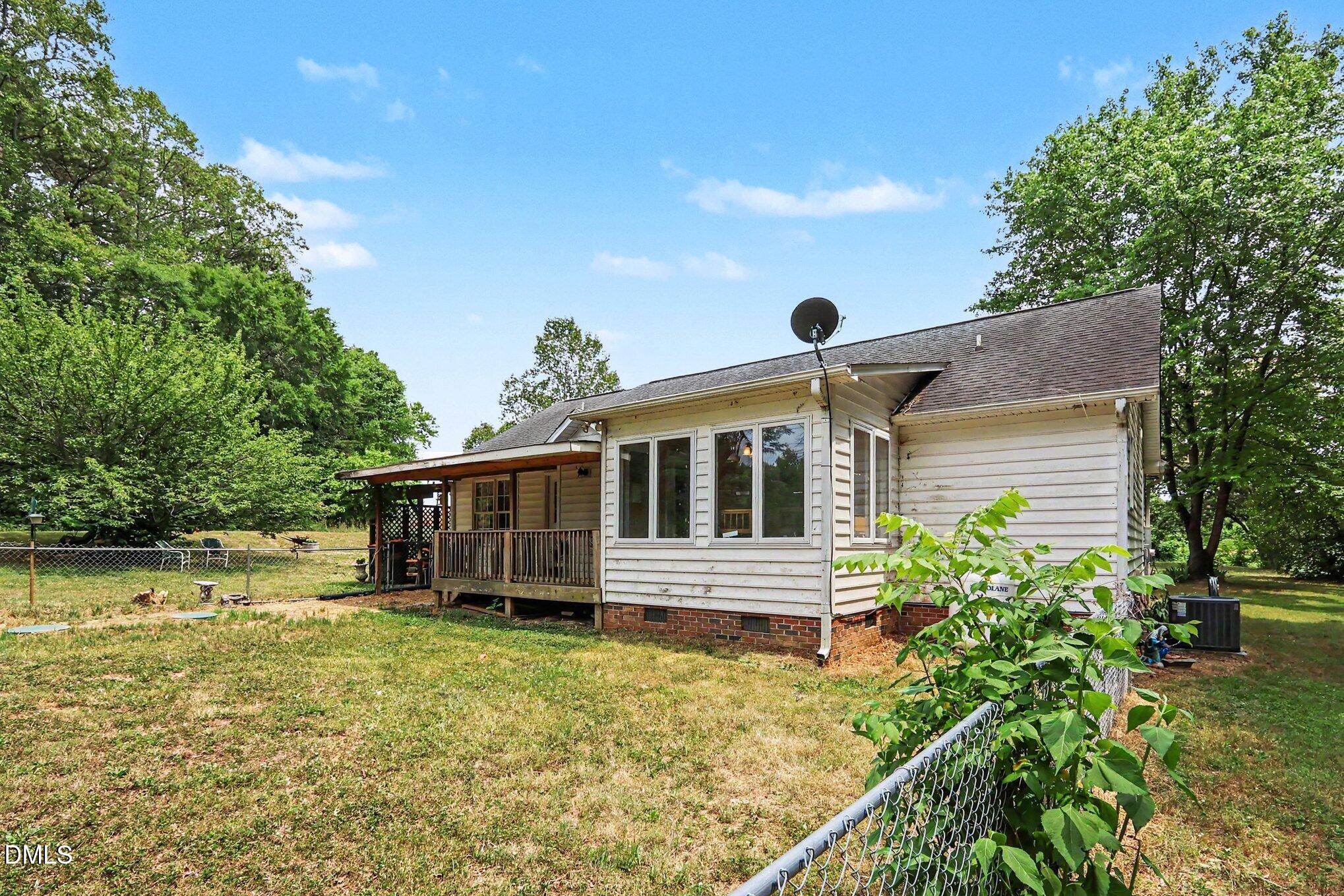 1750 Tom Oakley Road Timberlake, NC 27583 - Photo 23 of 31 front view of a house with a yard