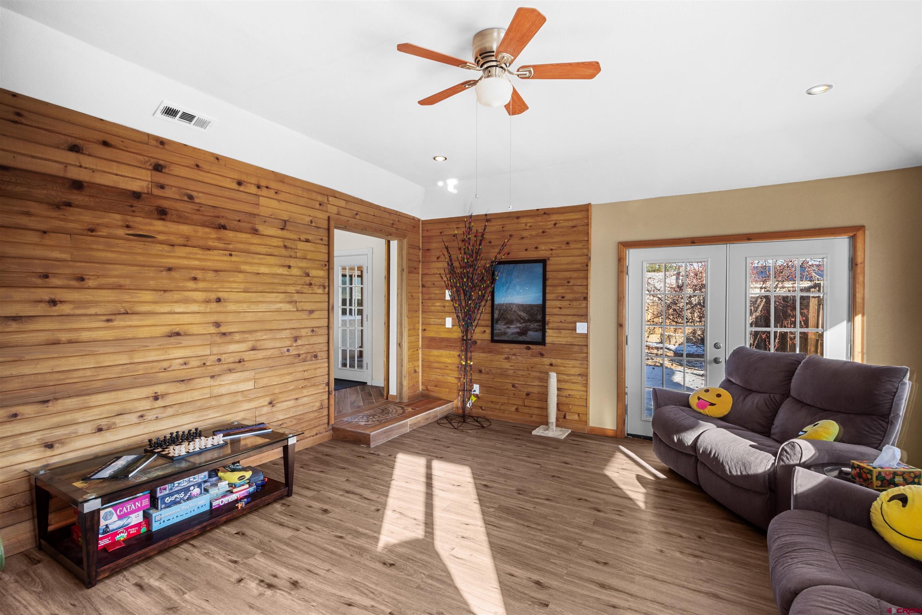 62920 Jeremy Road Montrose, CO 81401 - Photo 11 of 31 a living room with furniture and a flat screen tv