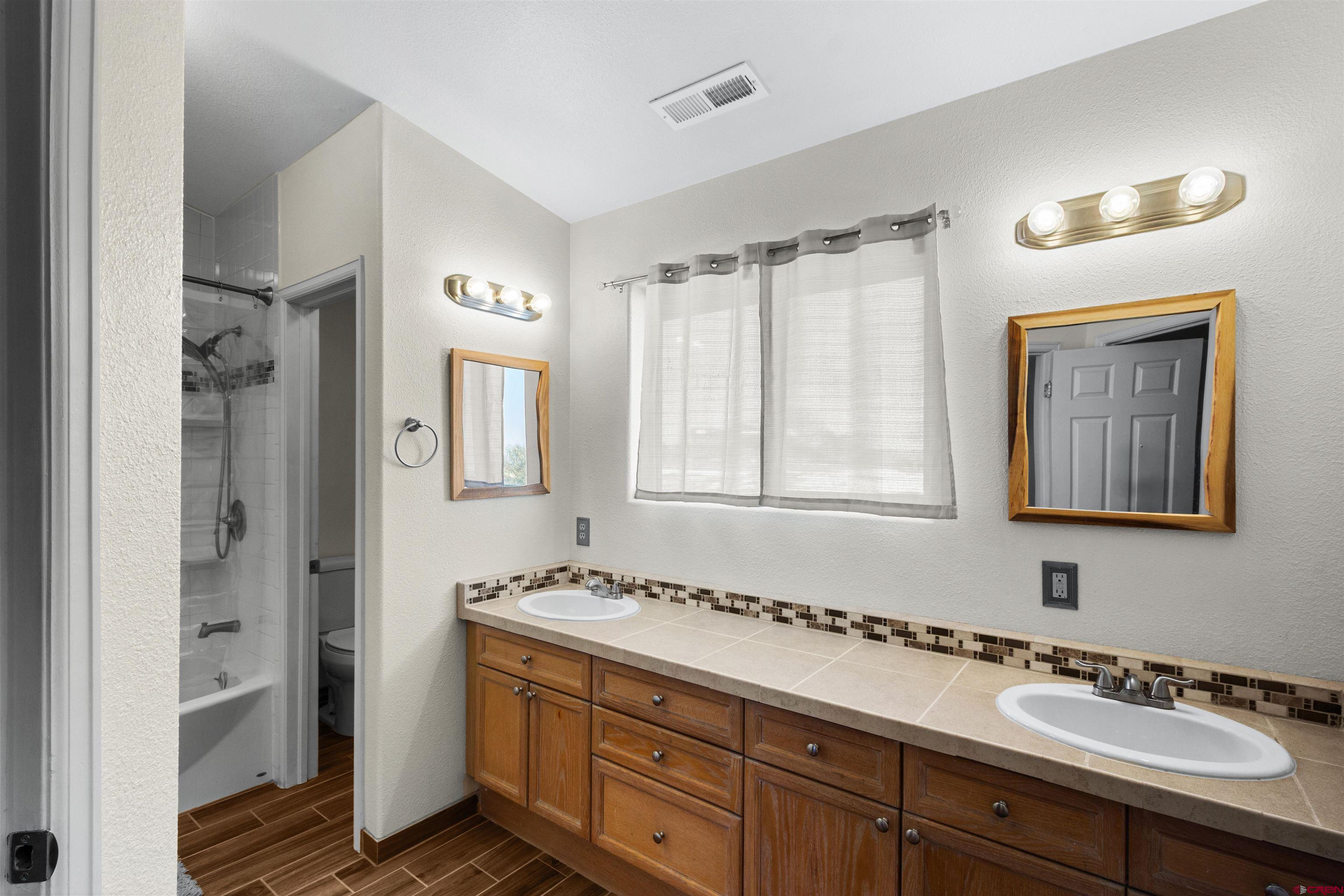 62920 Jeremy Road Montrose, CO 81401 - Photo 14 of 31 a bathroom with a sink and a mirror
