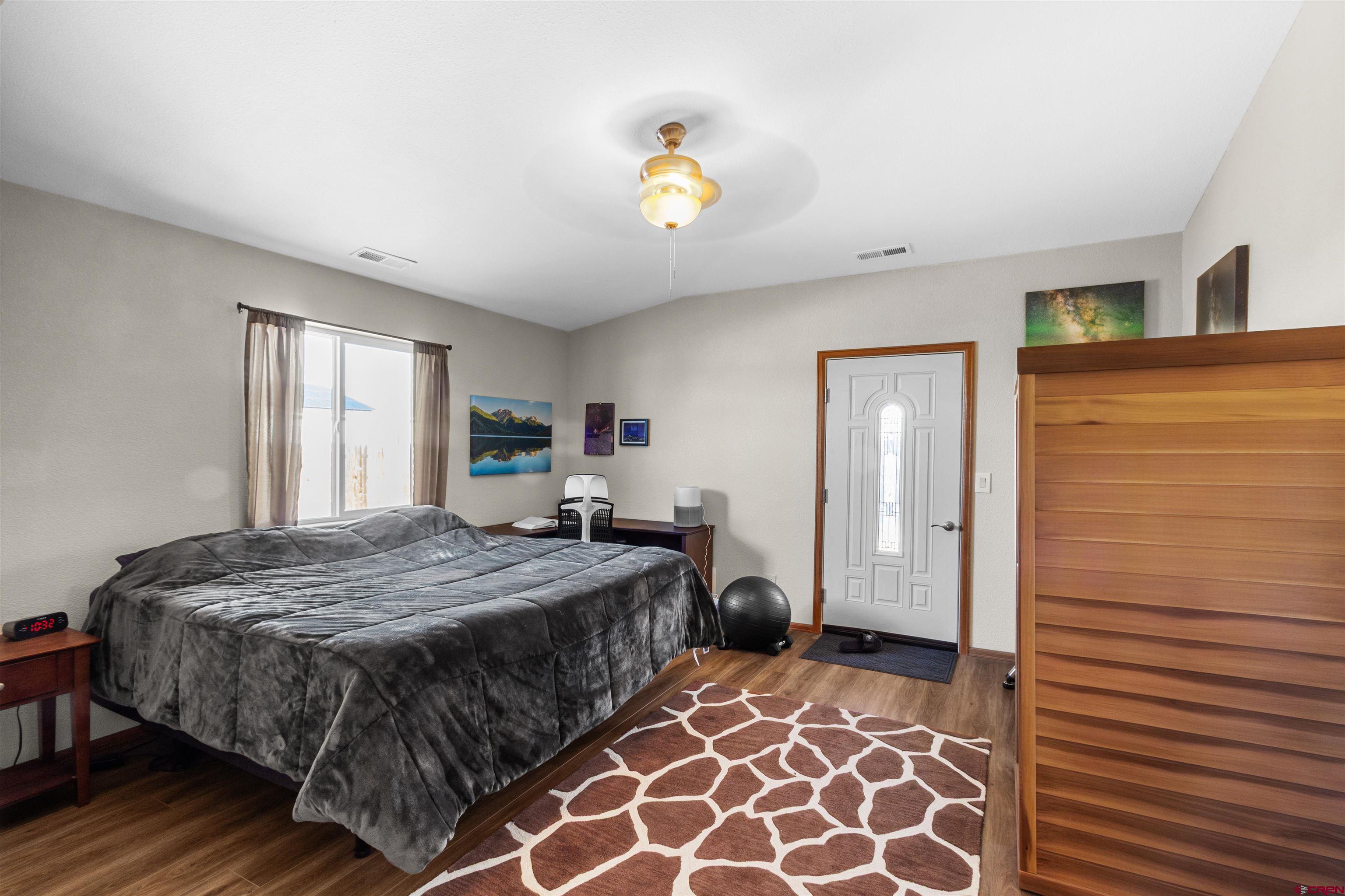 62920 Jeremy Road Montrose, CO 81401 - Photo 16 of 31 a bedroom with a bed and a window