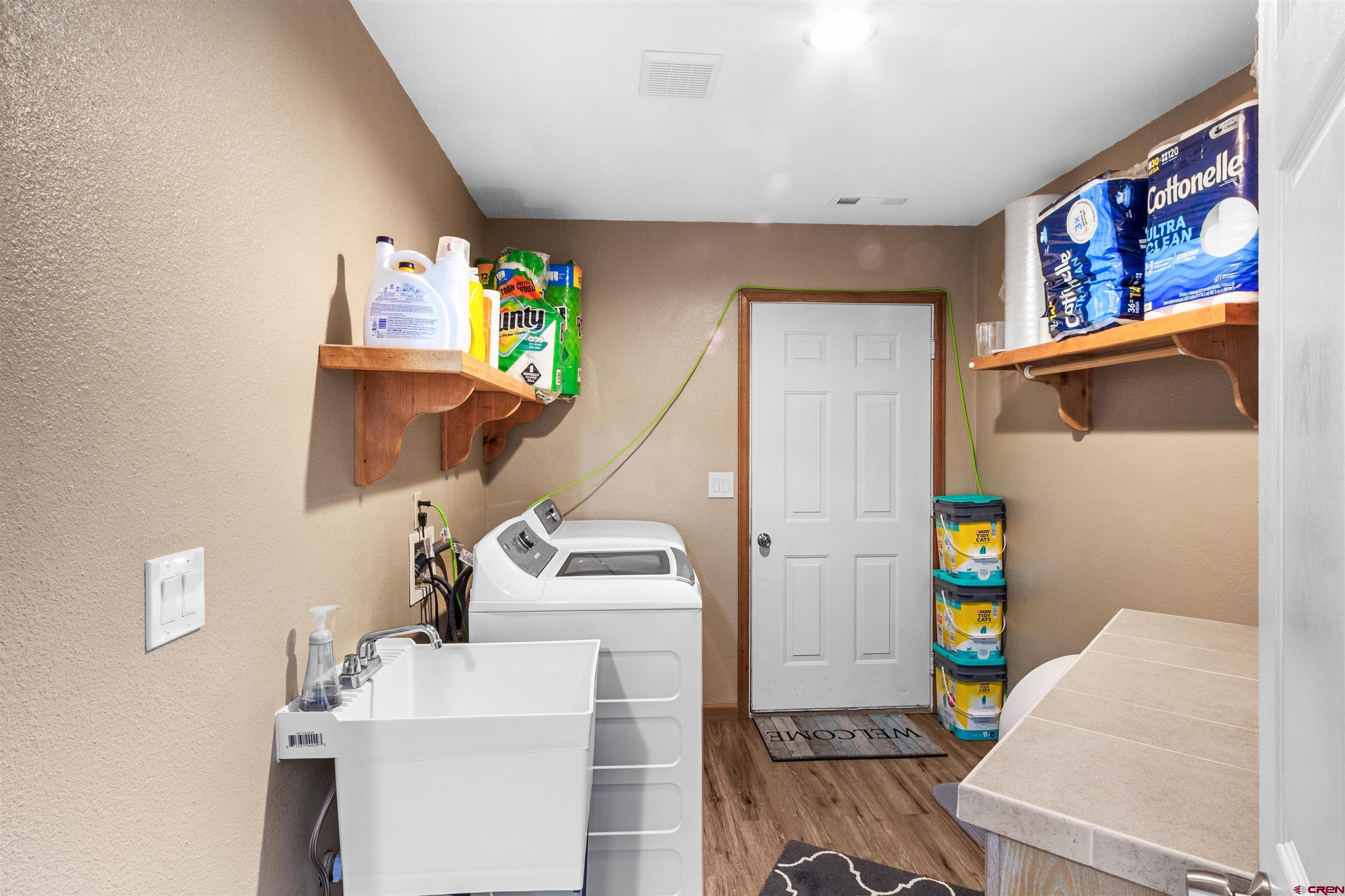 62920 Jeremy Road Montrose, CO 81401 - Photo 20 of 31 a living room with furniture and a couch