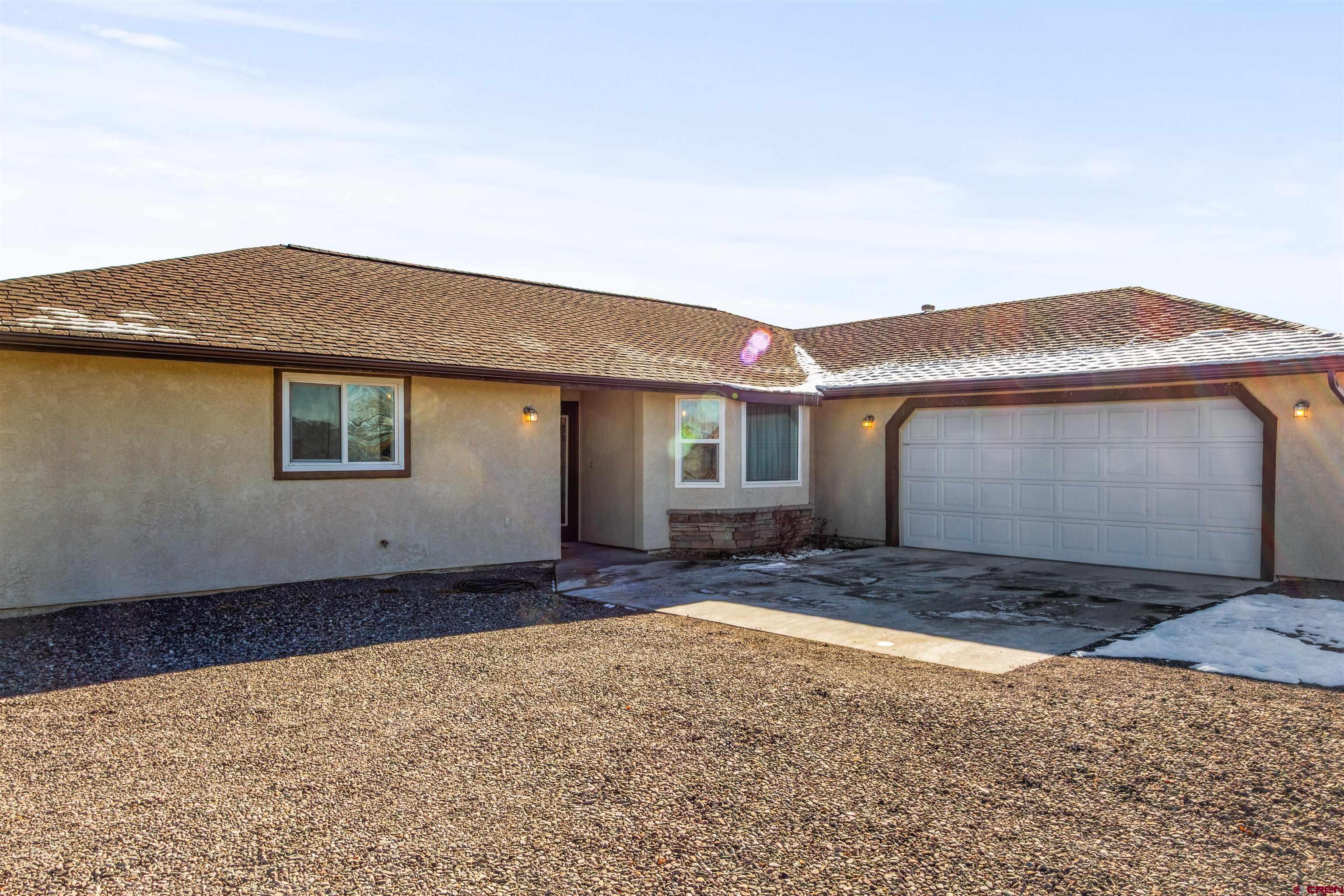 62920 Jeremy Road Montrose, CO 81401 - Photo 2 of 31 a house view with a backyard space