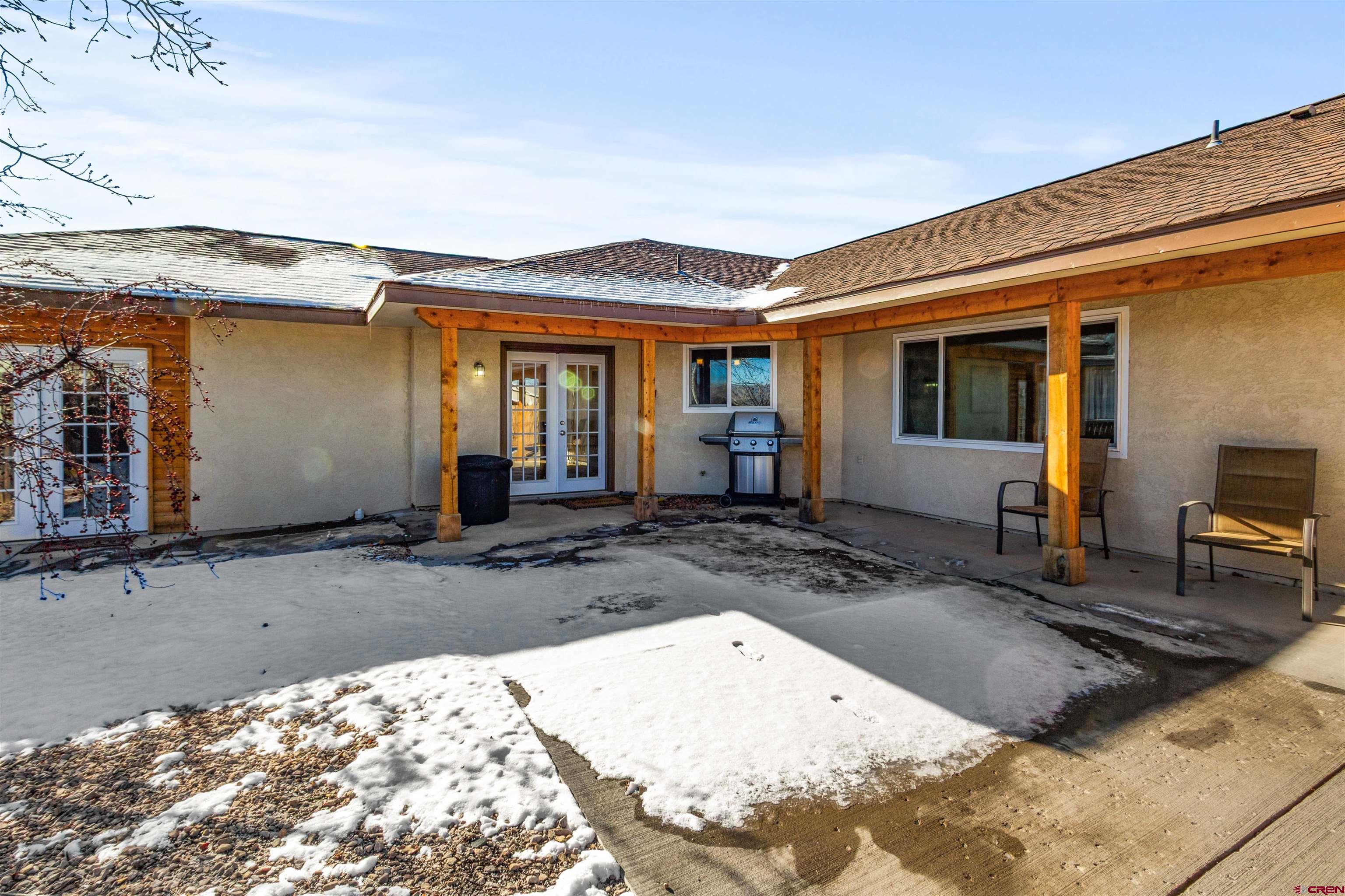 62920 Jeremy Road Montrose, CO 81401 - Photo 21 of 31 a view of a house with a snow in the background