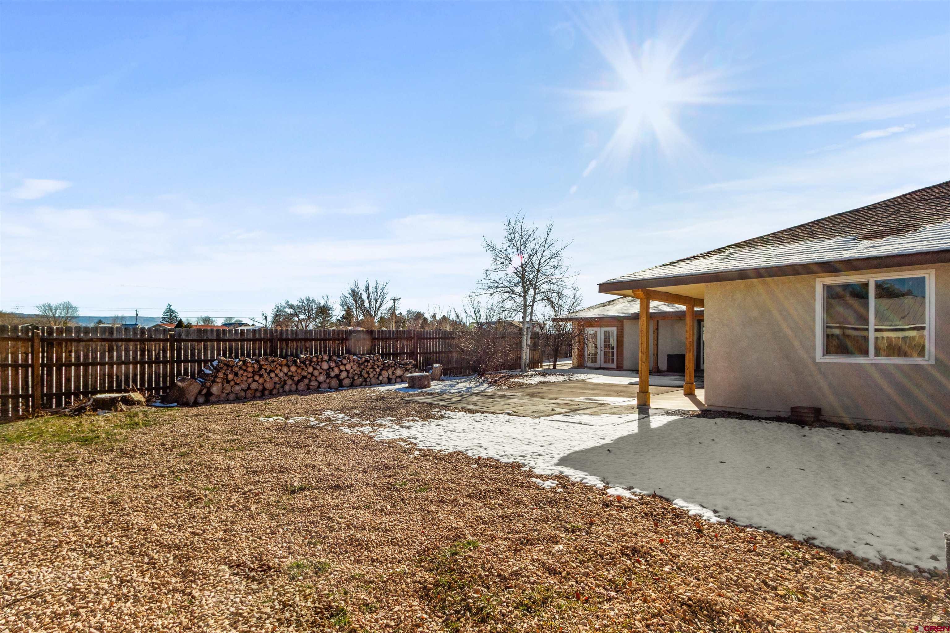 62920 Jeremy Road Montrose, CO 81401 - Photo 23 of 31 a view of a house with a patio