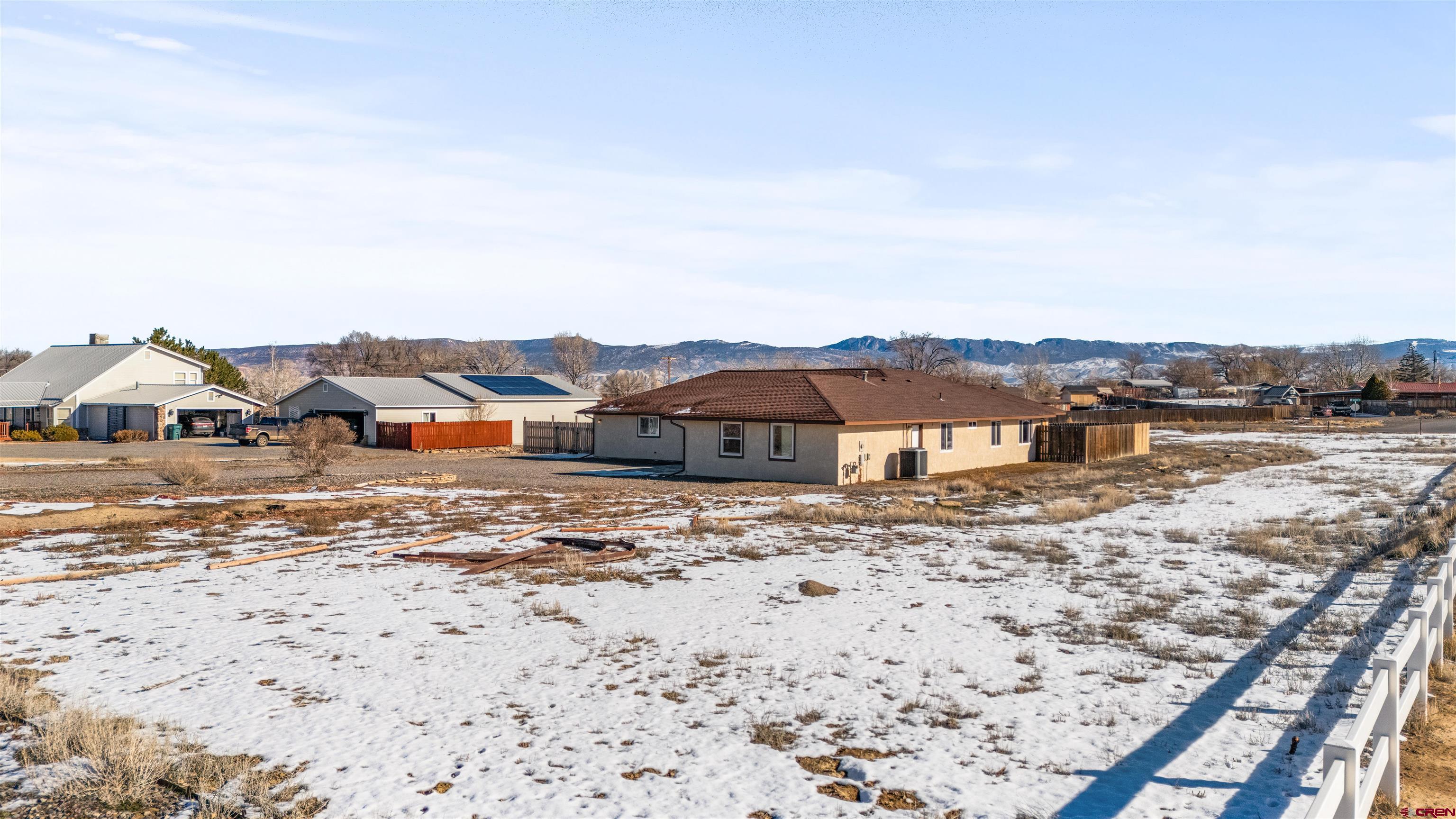 62920 Jeremy Road Montrose, CO 81401 - Photo 25 of 31 a front view of a house with a yard