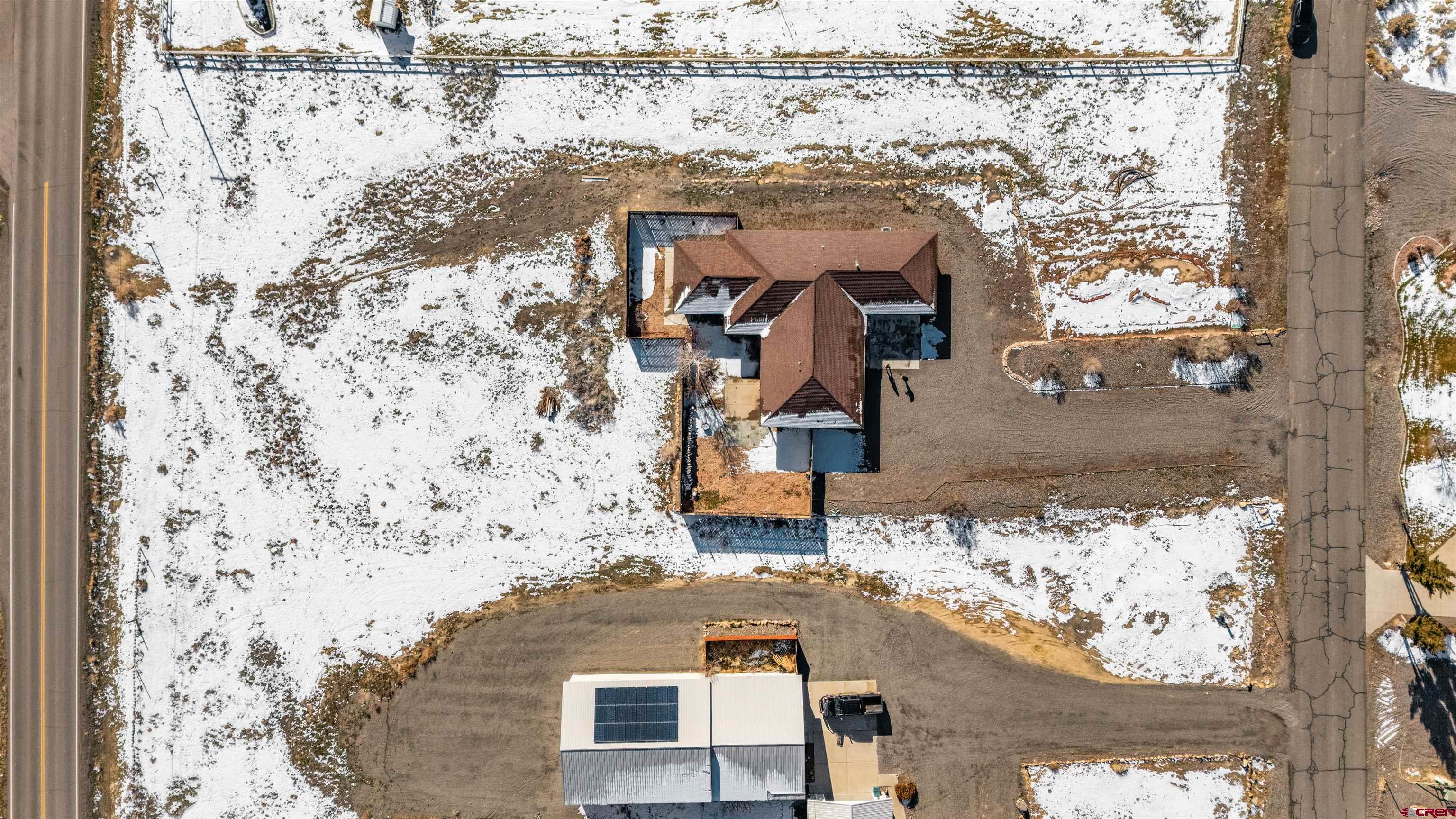 62920 Jeremy Road Montrose, CO 81401 - Photo 30 of 31 an aerial view of residential houses with outdoor space
