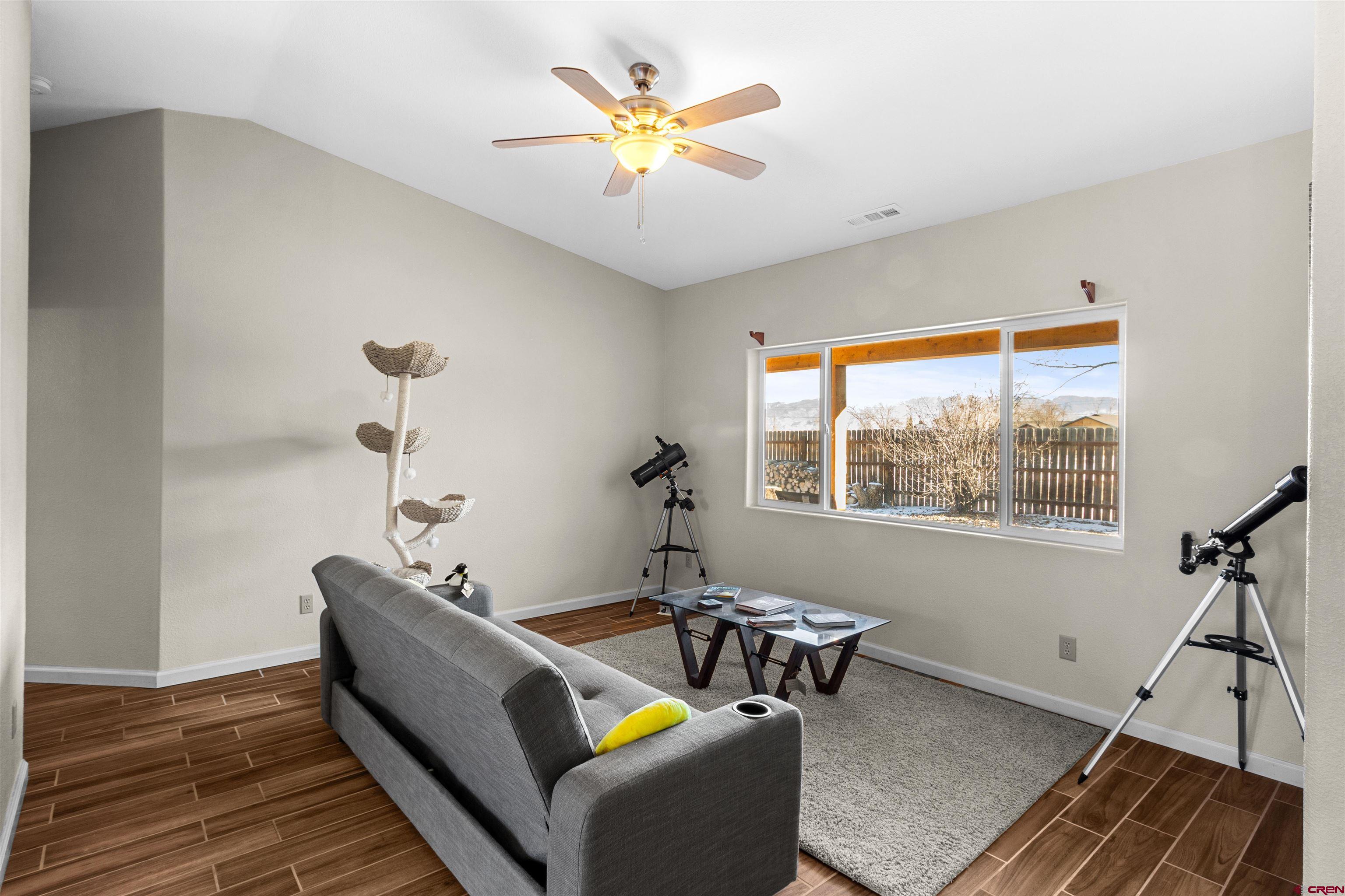 62920 Jeremy Road Montrose, CO 81401 - Photo 3 of 31 a living room with furniture and a window