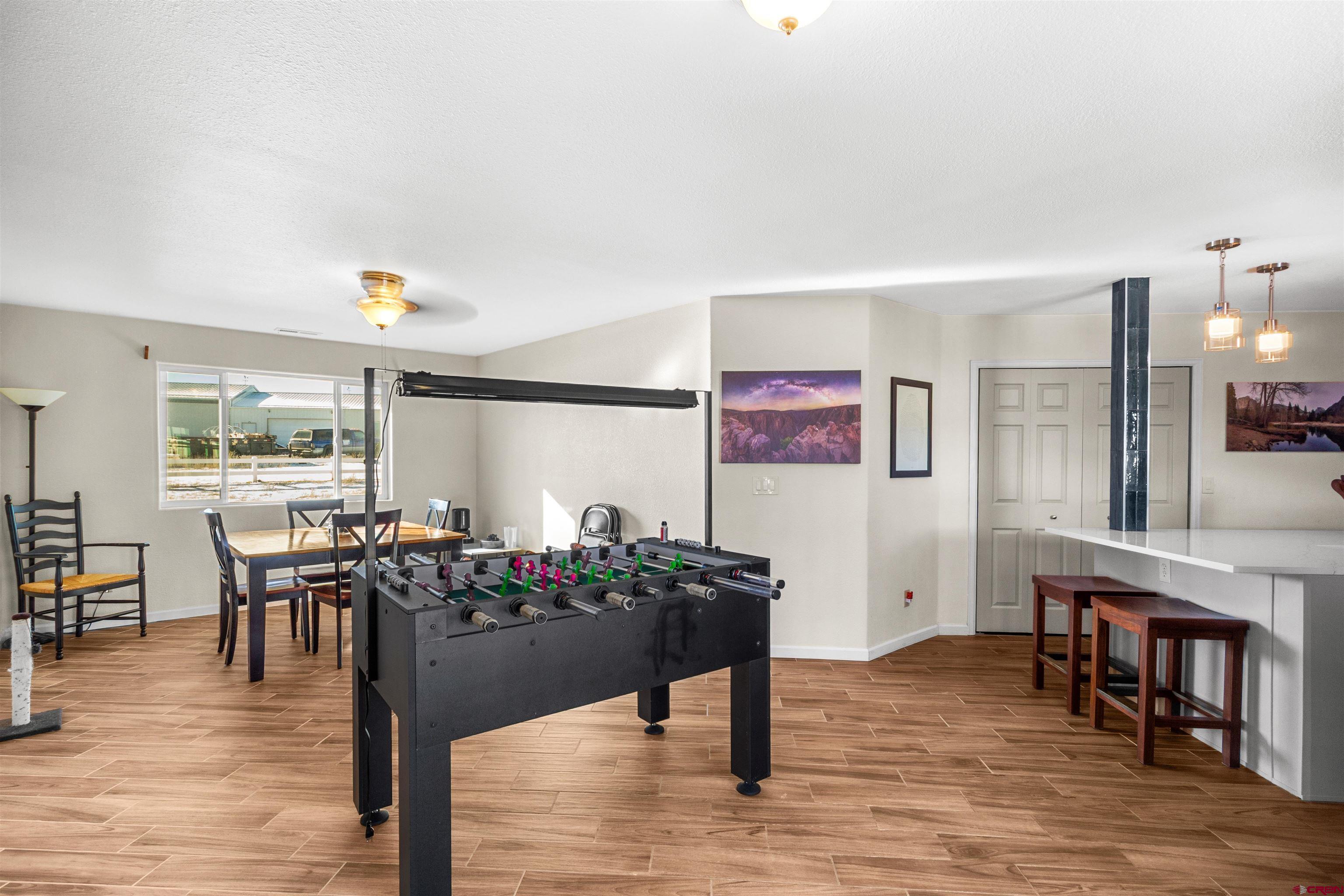62920 Jeremy Road Montrose, CO 81401 - Photo 7 of 31 a living room with furniture and wooden floor