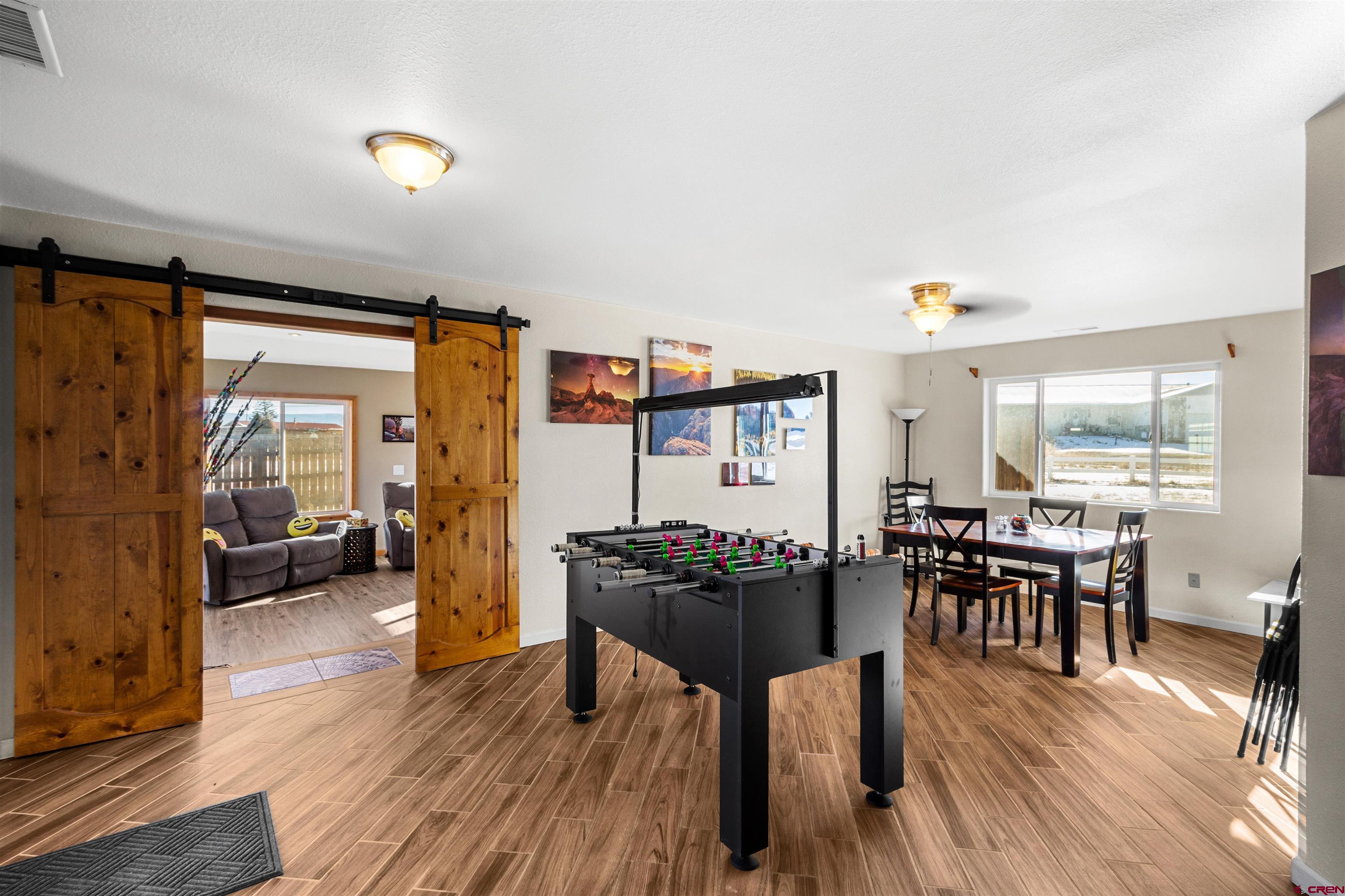 62920 Jeremy Road Montrose, CO 81401 - Photo 9 of 31 a living room with furniture and wooden floor