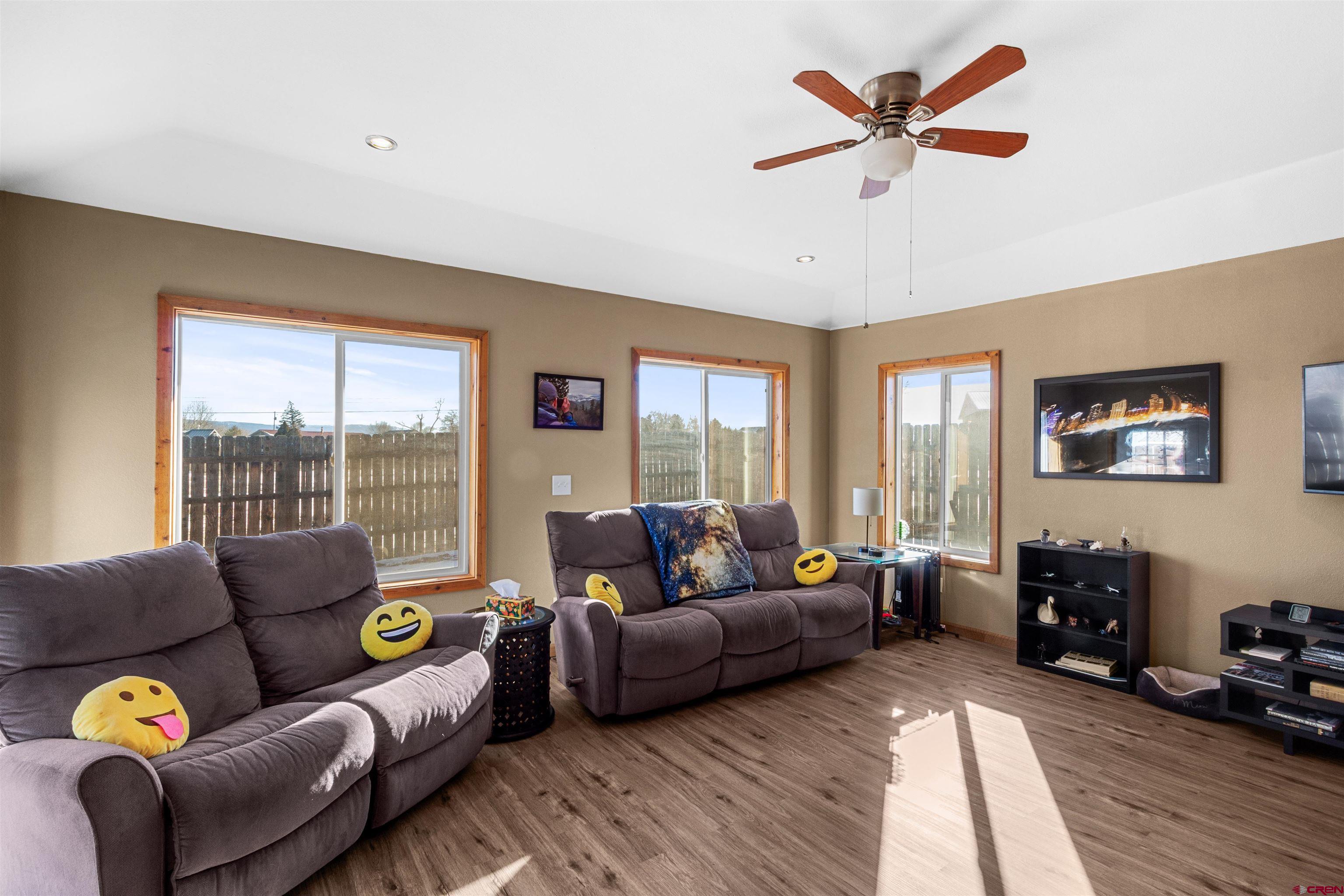 62920 Jeremy Road Montrose, CO 81401 - Photo 10 of 31 a living room with furniture and a large window