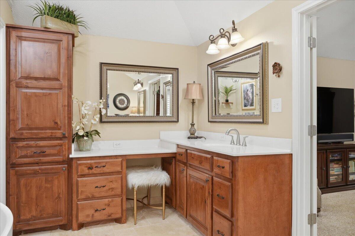 4612 100th Street Lubbock, TX 79424 - Photo 33 of 55 a bathroom with a sink a vanity and a mirror