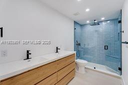 11256 Southwest 90th Lane, Unit 11256 Miami, FL 33176 - Photo 20 of 36 a bathroom with a sink a toilet and shower