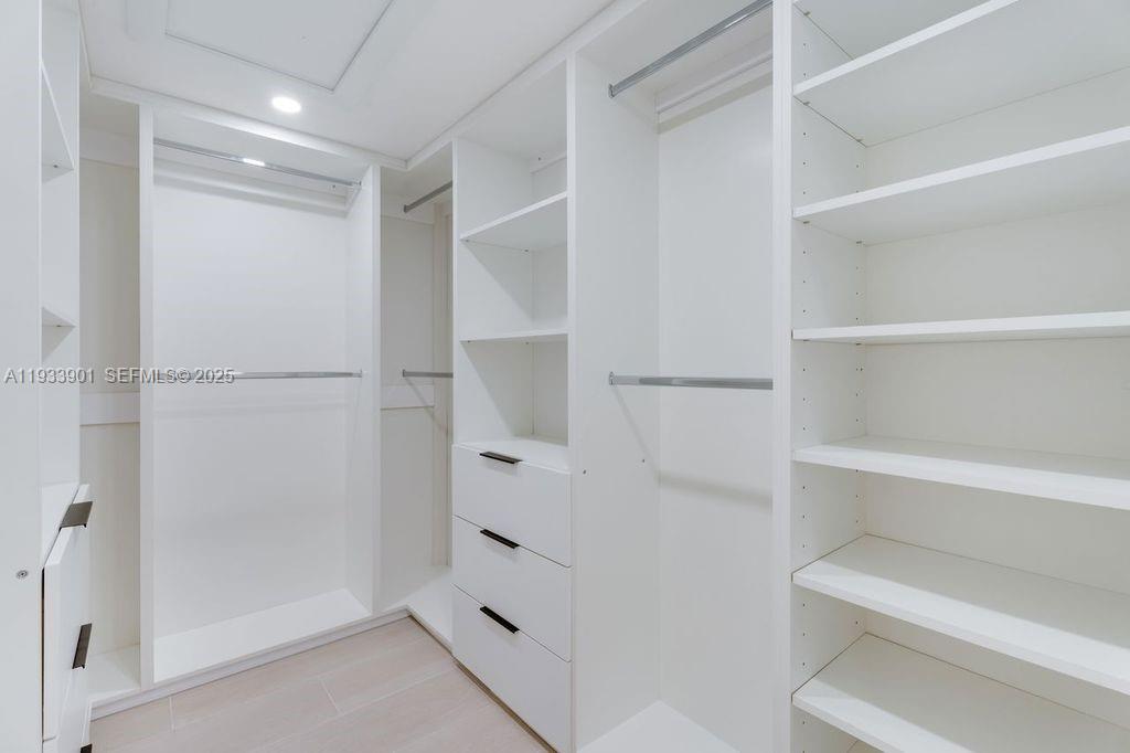 11256 Southwest 90th Lane, Unit 11256 Miami, FL 33176 - Photo 21 of 36 a view of an empty walk in closet