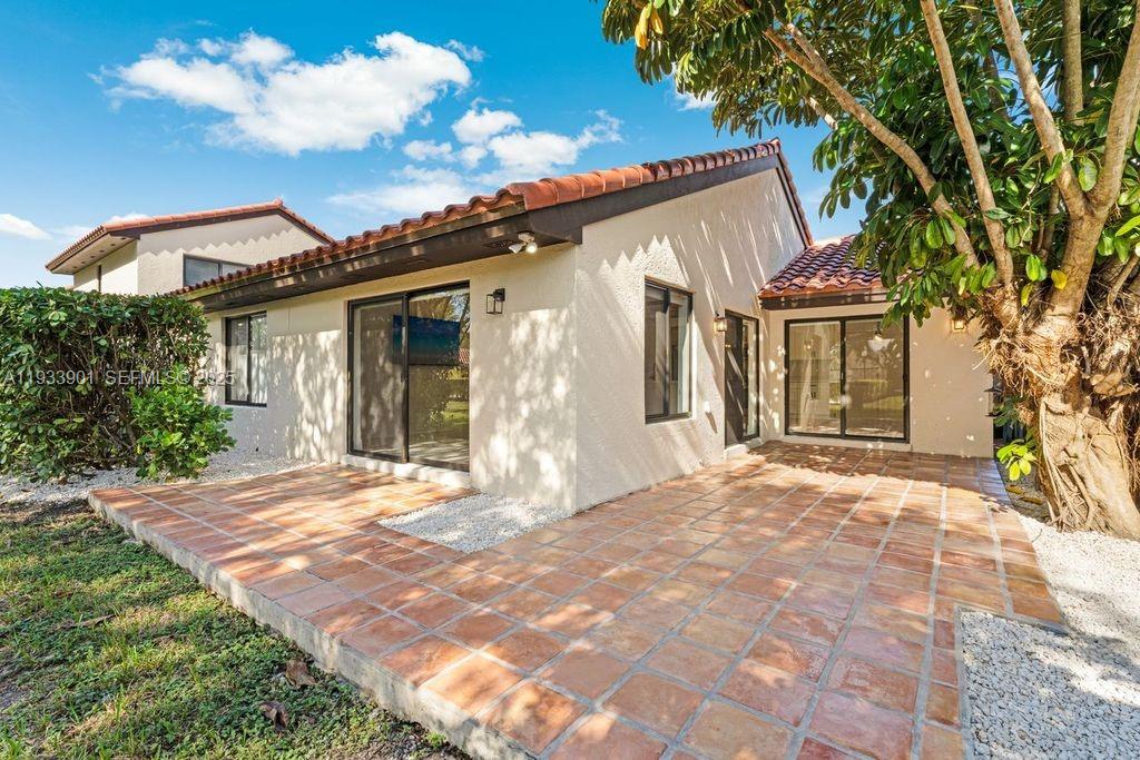 11256 Southwest 90th Lane, Unit 11256 Miami, FL 33176 - Photo 24 of 36 a view of a house with a yard