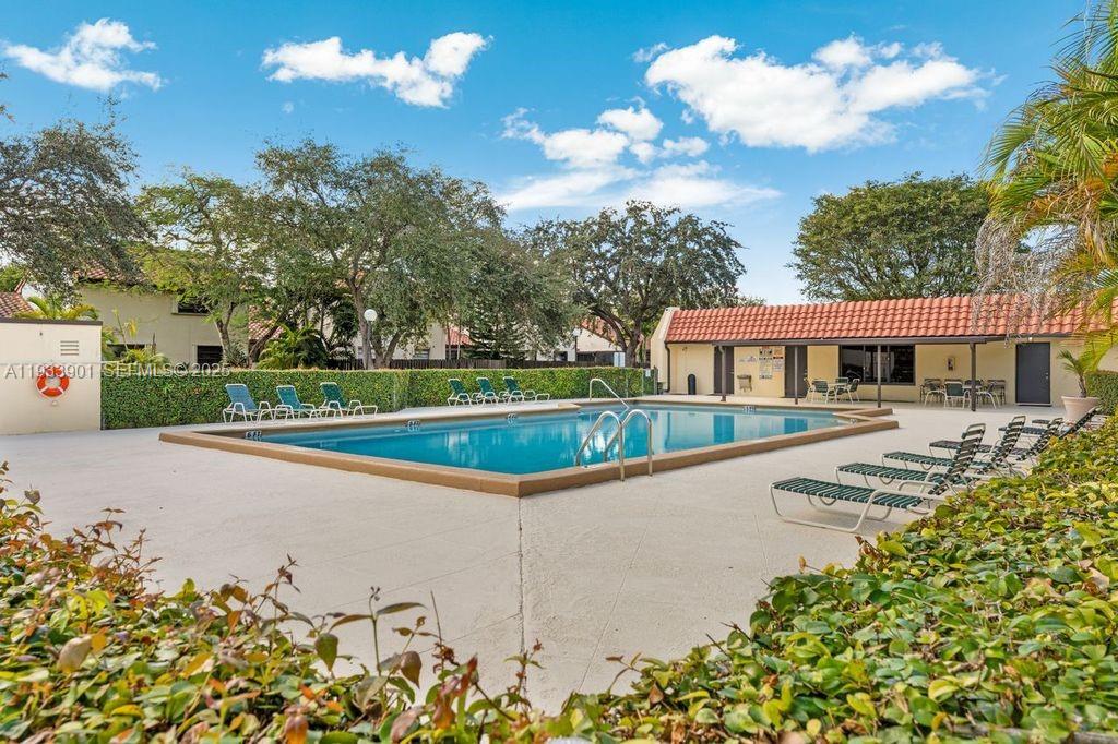 11256 Southwest 90th Lane, Unit 11256 Miami, FL 33176 - Photo 29 of 36 a view of a house with a swimming pool