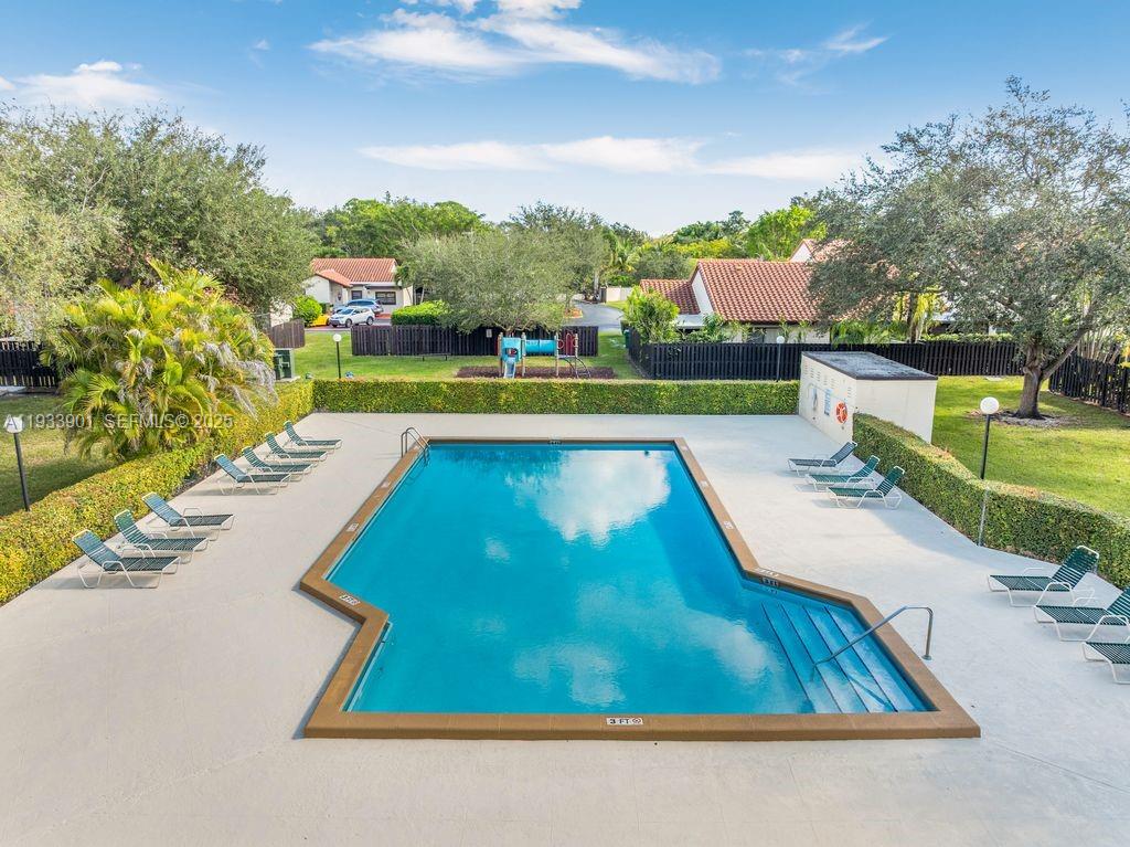 11256 Southwest 90th Lane, Unit 11256 Miami, FL 33176 - Photo 30 of 36 a view of swimming pool with a yard