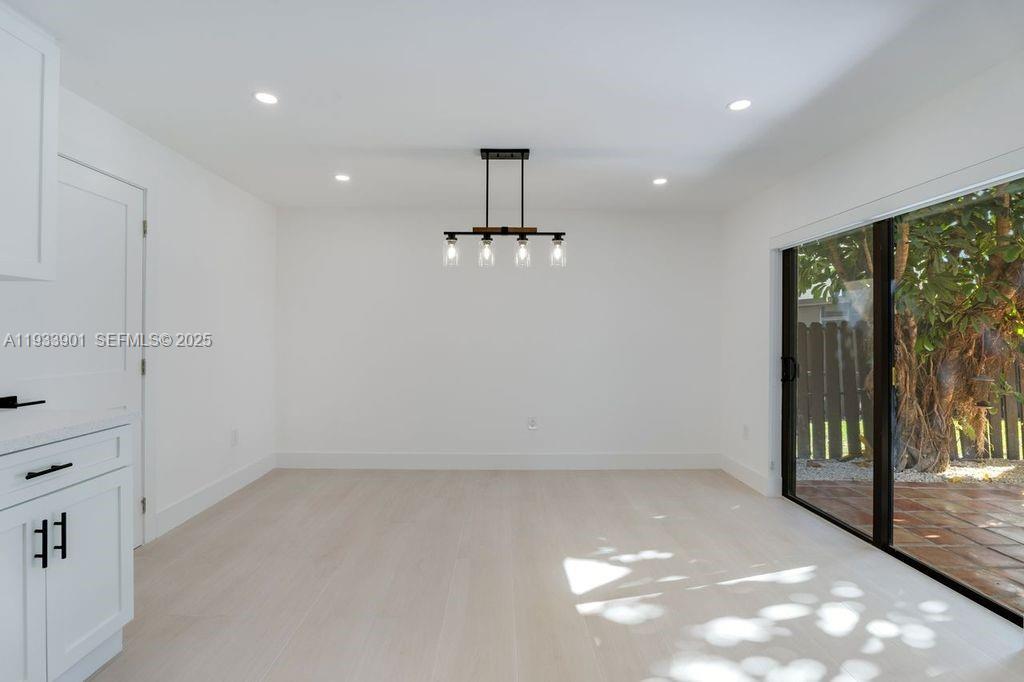 11256 Southwest 90th Lane, Unit 11256 Miami, FL 33176 - Photo 4 of 36 a view of an empty room with a window
