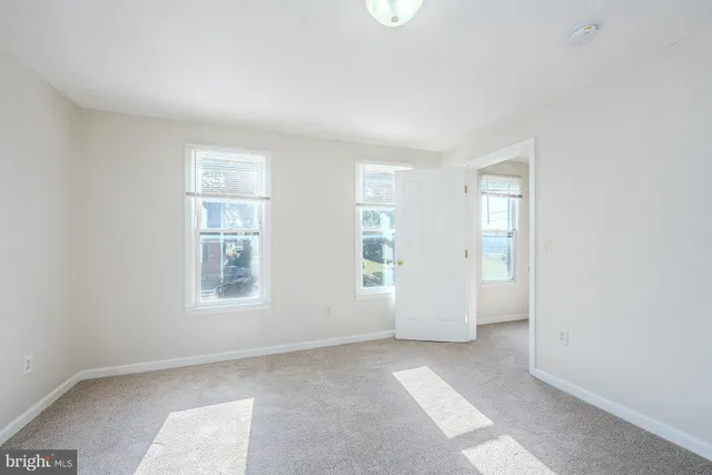 an empty room with windows