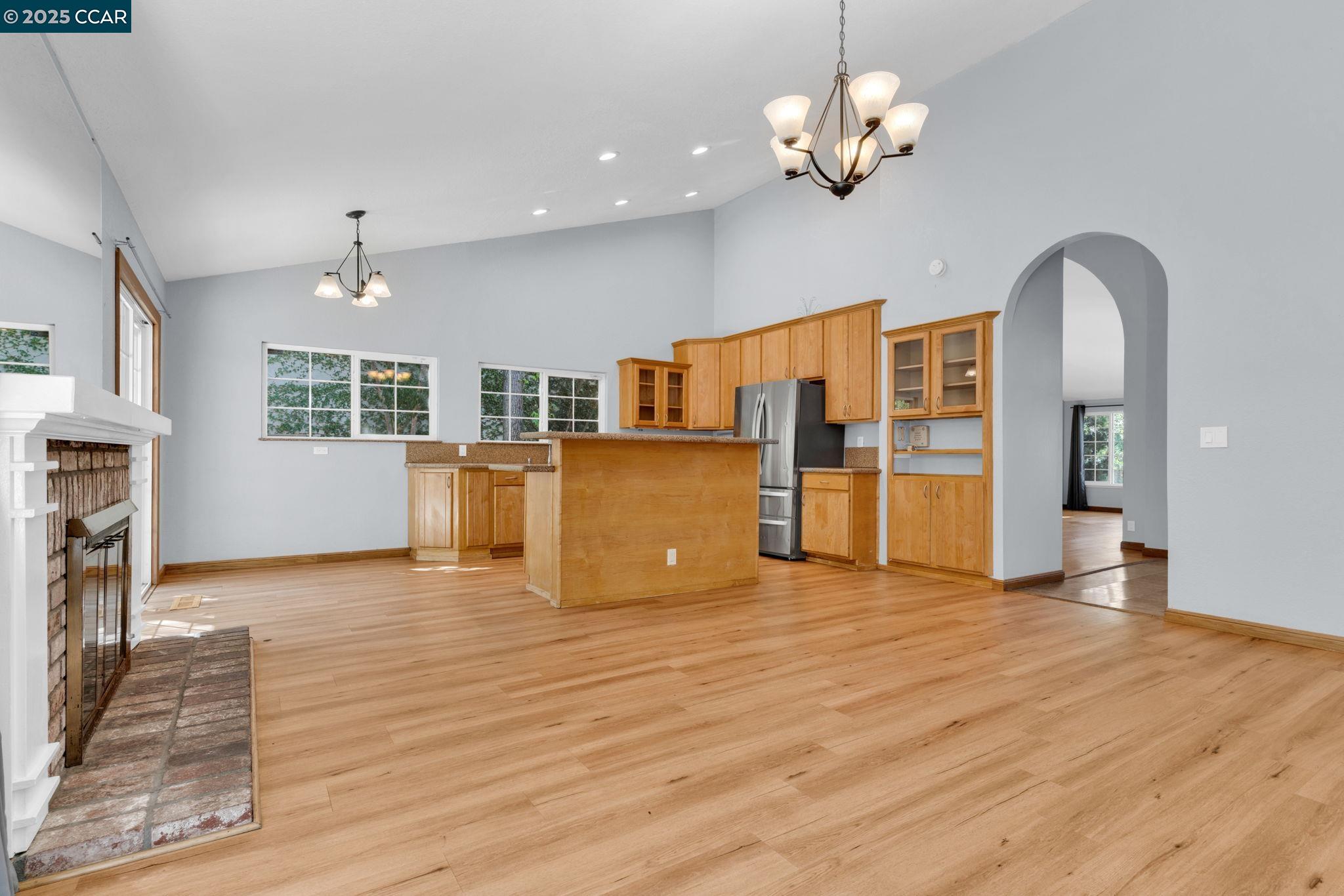 920 Palmer Road Walnut Creek, CA 94596 - Photo 12 of 47 a view of a livingroom with a chandelier furniture and wooden floor