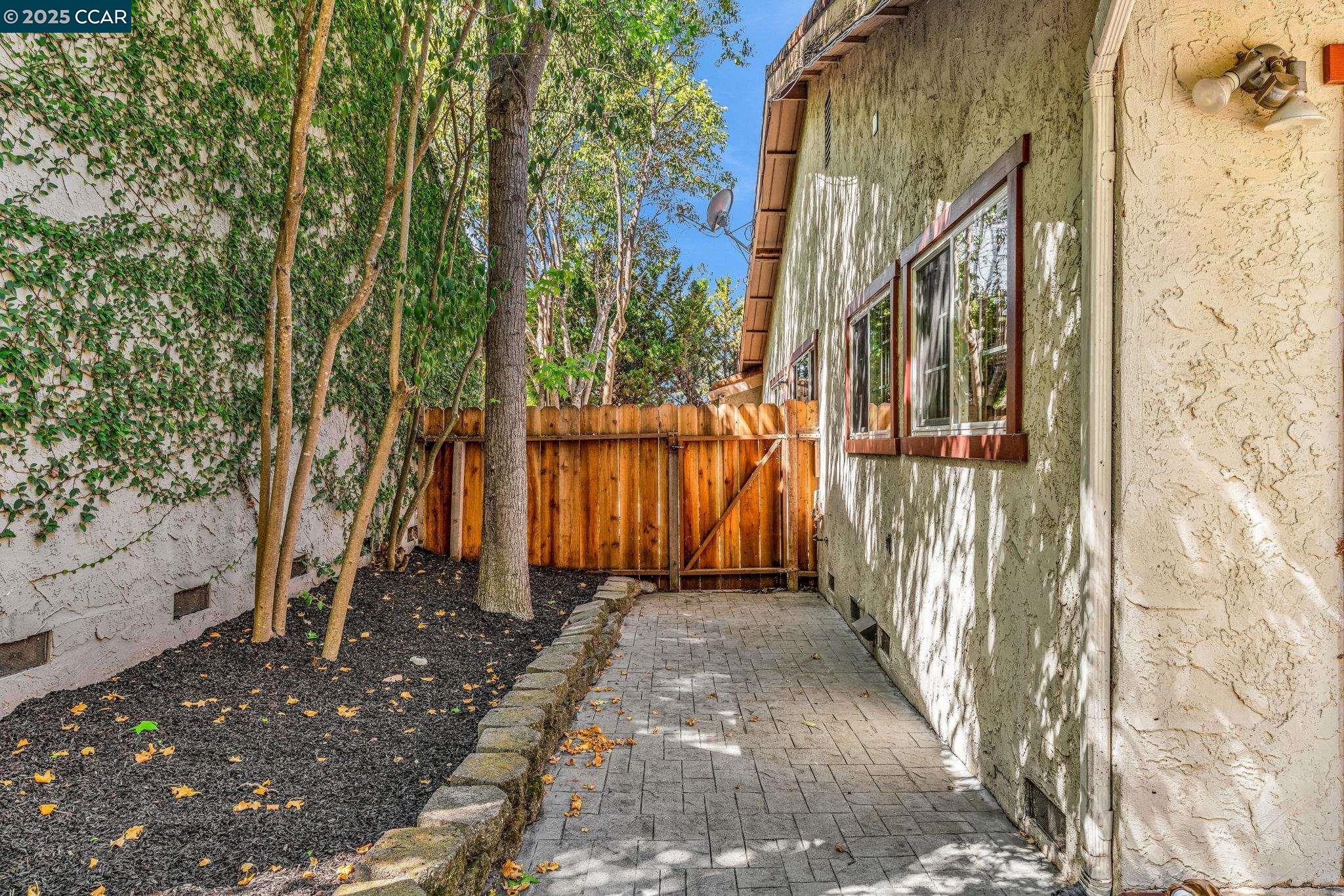 920 Palmer Road Walnut Creek, CA 94596 - Photo 18 of 47 a view of a pathway of a house with a tree