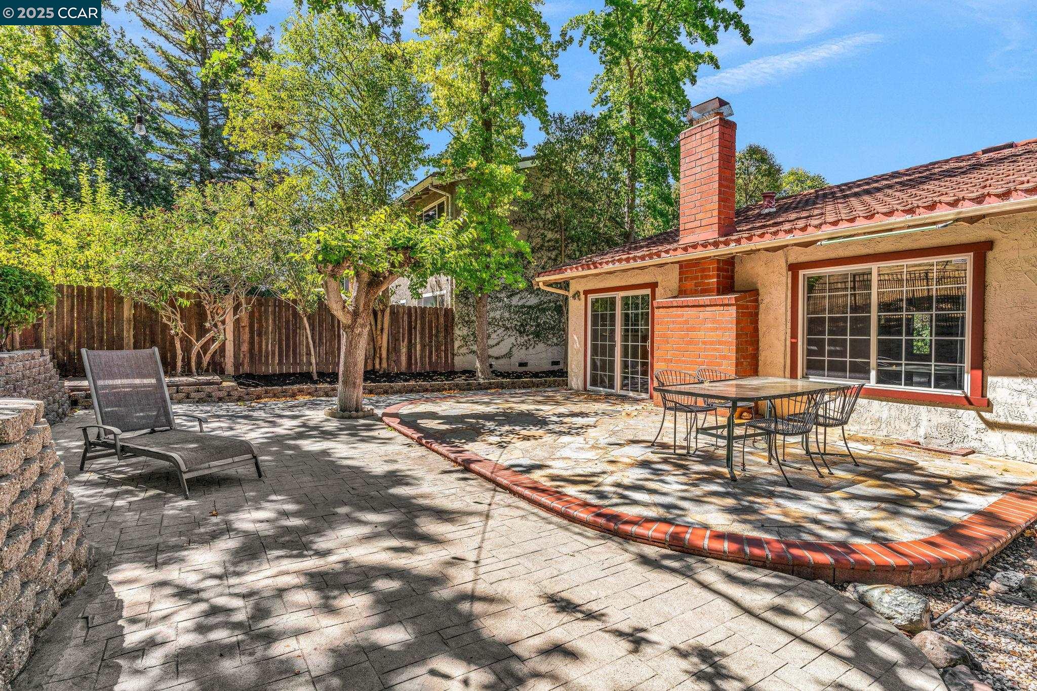 920 Palmer Road Walnut Creek, CA 94596 - Photo 19 of 47 a table and chairs in front of house