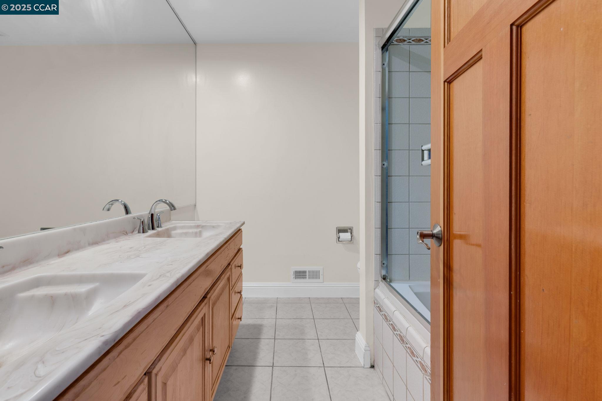 920 Palmer Road Walnut Creek, CA 94596 - Photo 24 of 47 a bathroom with a granite countertop sink and a mirror