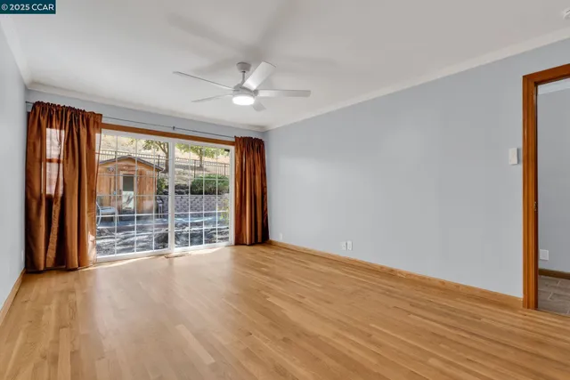 a view of an empty room with glass door