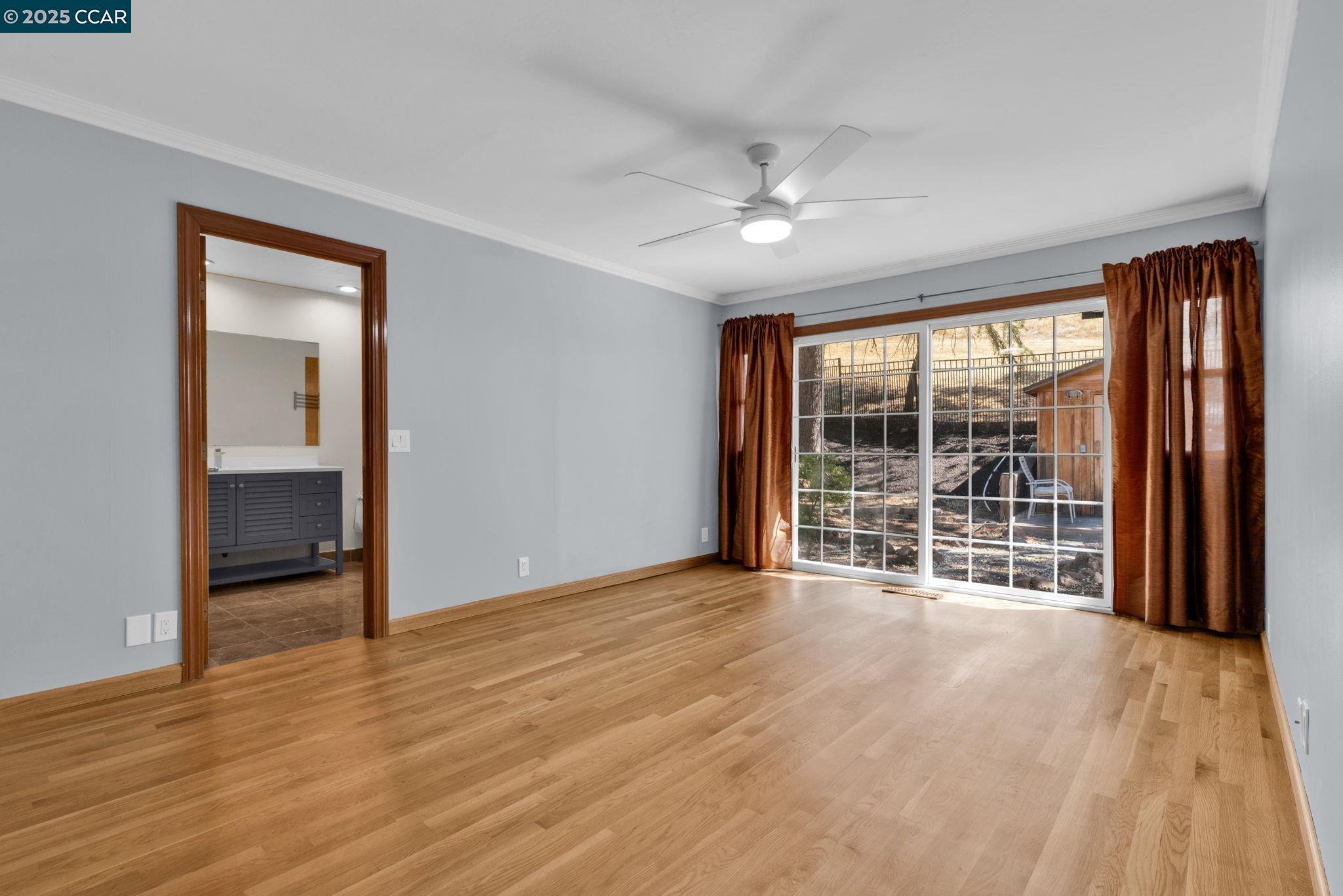 920 Palmer Road Walnut Creek, CA 94596 - Photo 32 of 47 a view of an empty room with wooden floor and a window