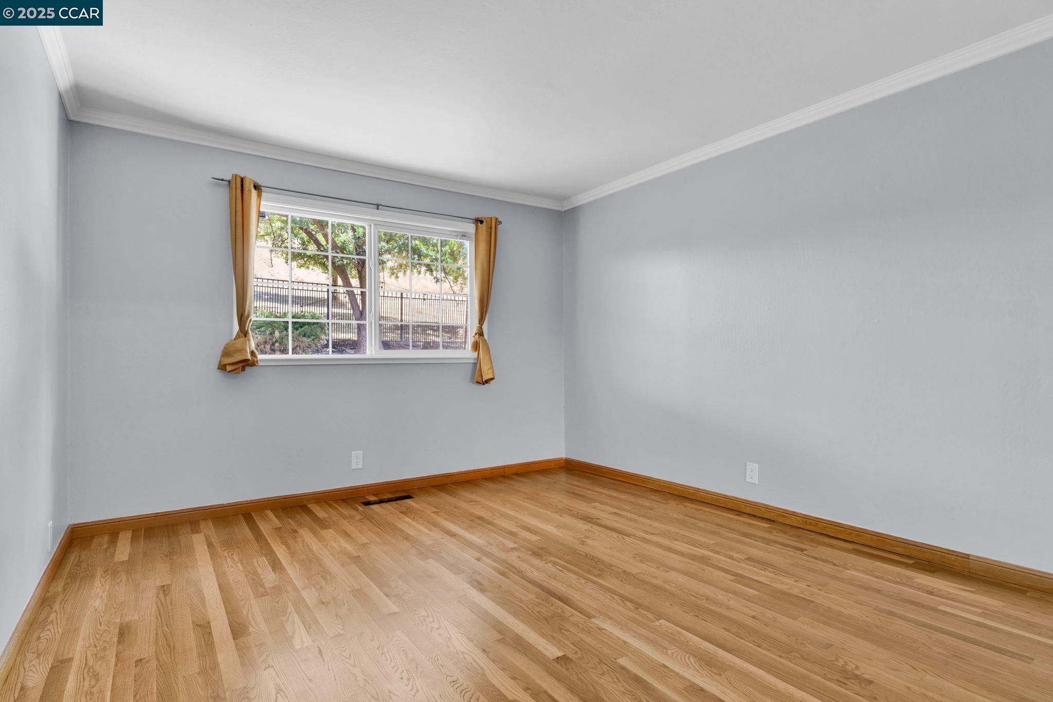 920 Palmer Road Walnut Creek, CA 94596 - Photo 34 of 47 a view of an empty room with wooden floor and a window
