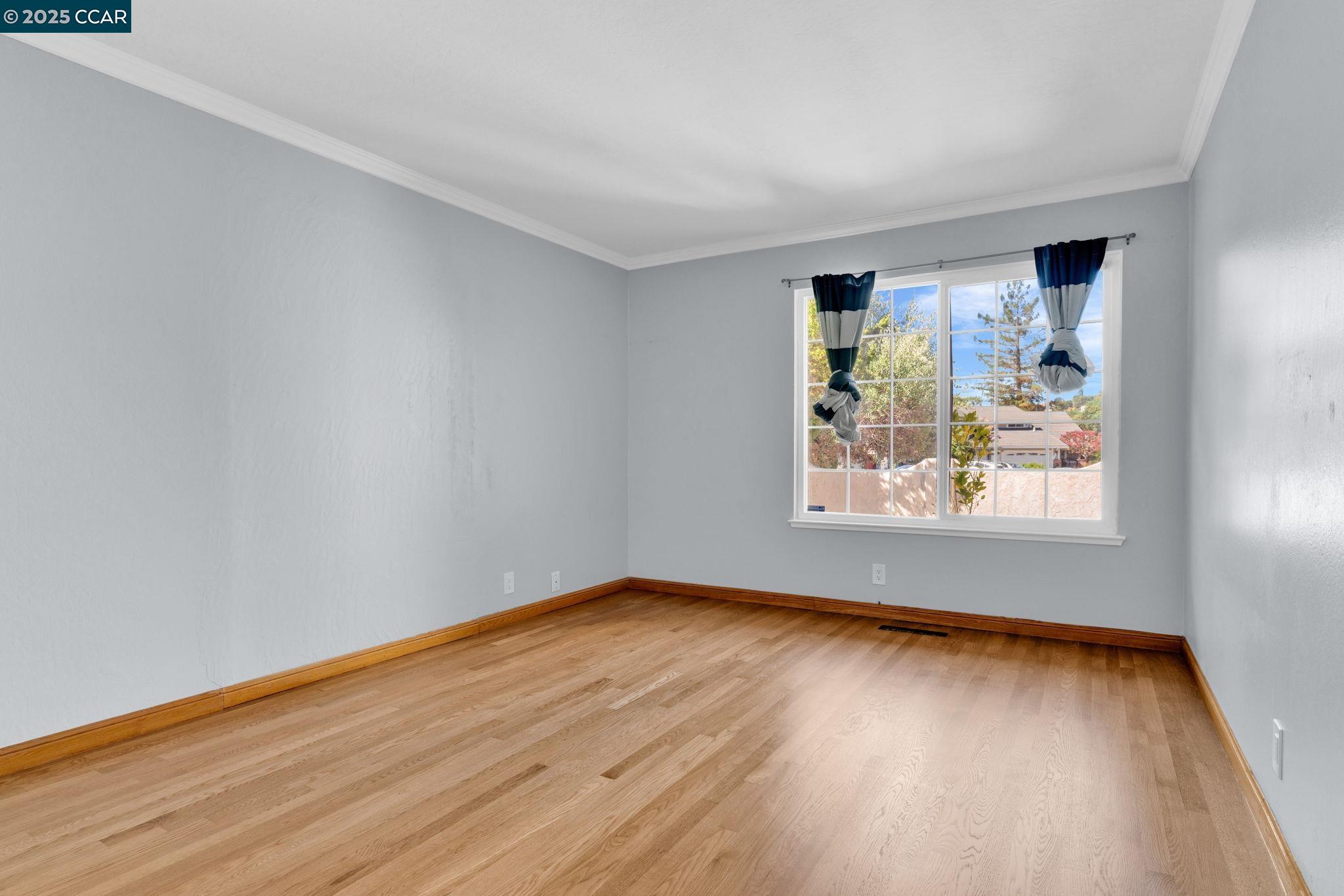920 Palmer Road Walnut Creek, CA 94596 - Photo 35 of 47 a view of a room with wooden floor and window