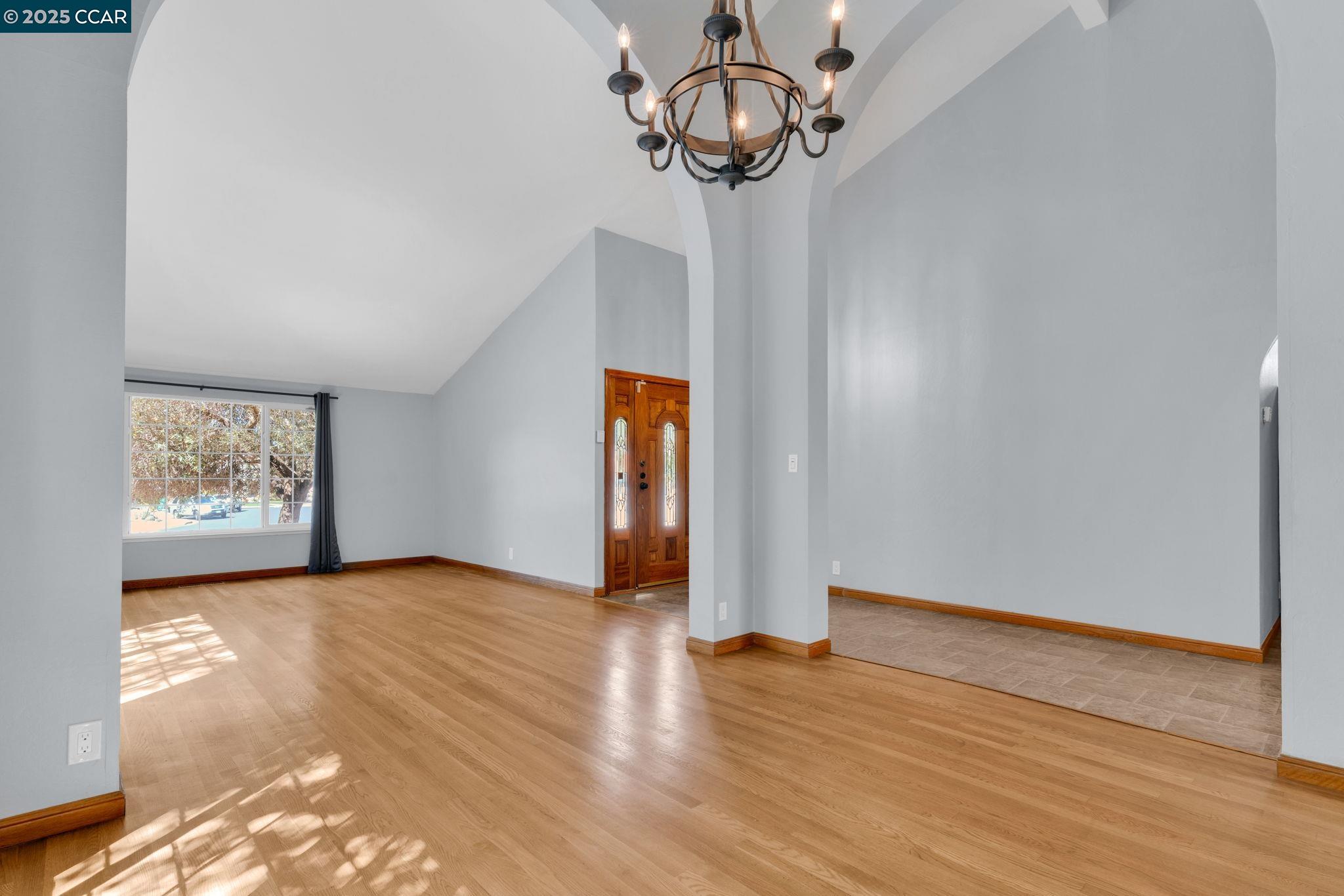 920 Palmer Road Walnut Creek, CA 94596 - Photo 40 of 47 a view of an empty room with wooden floor and windows