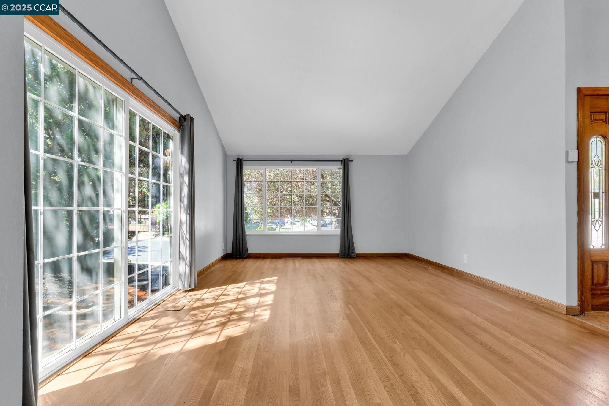 920 Palmer Road Walnut Creek, CA 94596 - Photo 42 of 47 a view of an empty room with a window and wooden floor