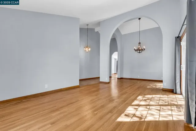 a view of an empty room and glass door