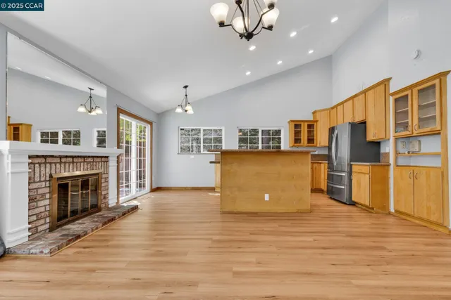 a view of a kitchen with a stove cabinets and wooden floor