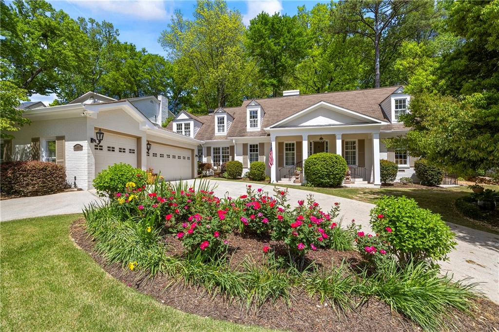 998 Ferncliff Road Northeast Atlanta, GA 30324 - Photo 1 of 1 a front view of a house with a yard and fountain