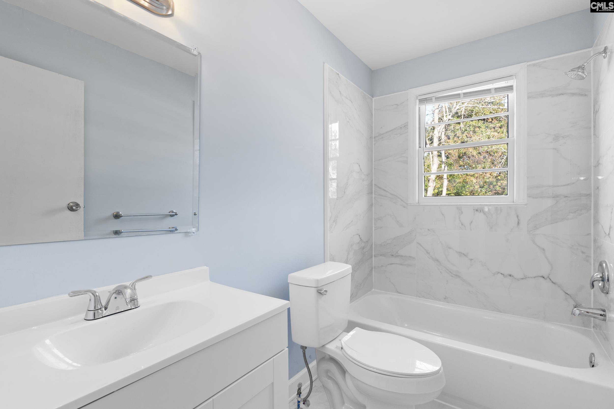 409 Wilkes Road Columbia, SC 29203 - Photo 28 of 34 a bathroom with a sink toilet and bathtub